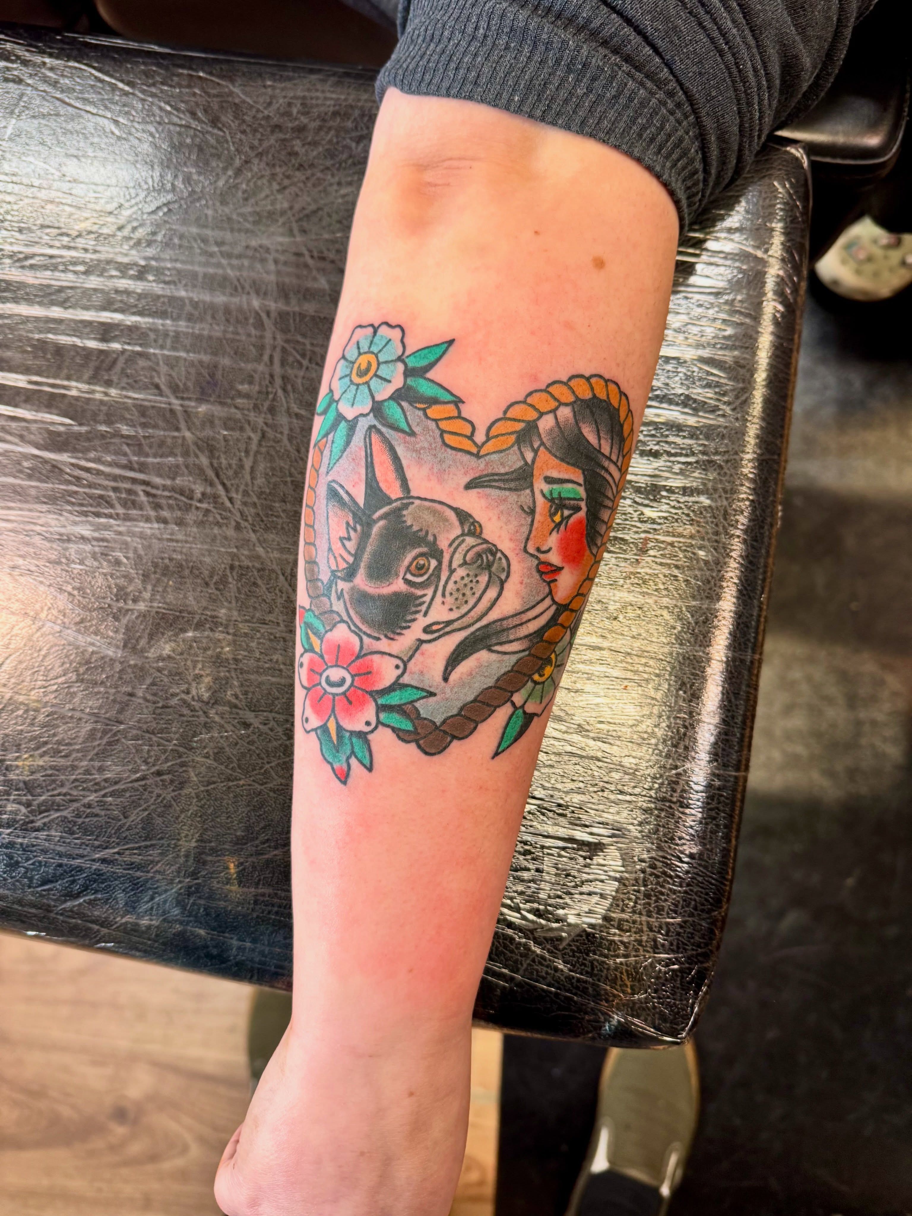 Woman and dog American traditional tattoo on the forearm by Justin Chapman, Des Moines, Iowa