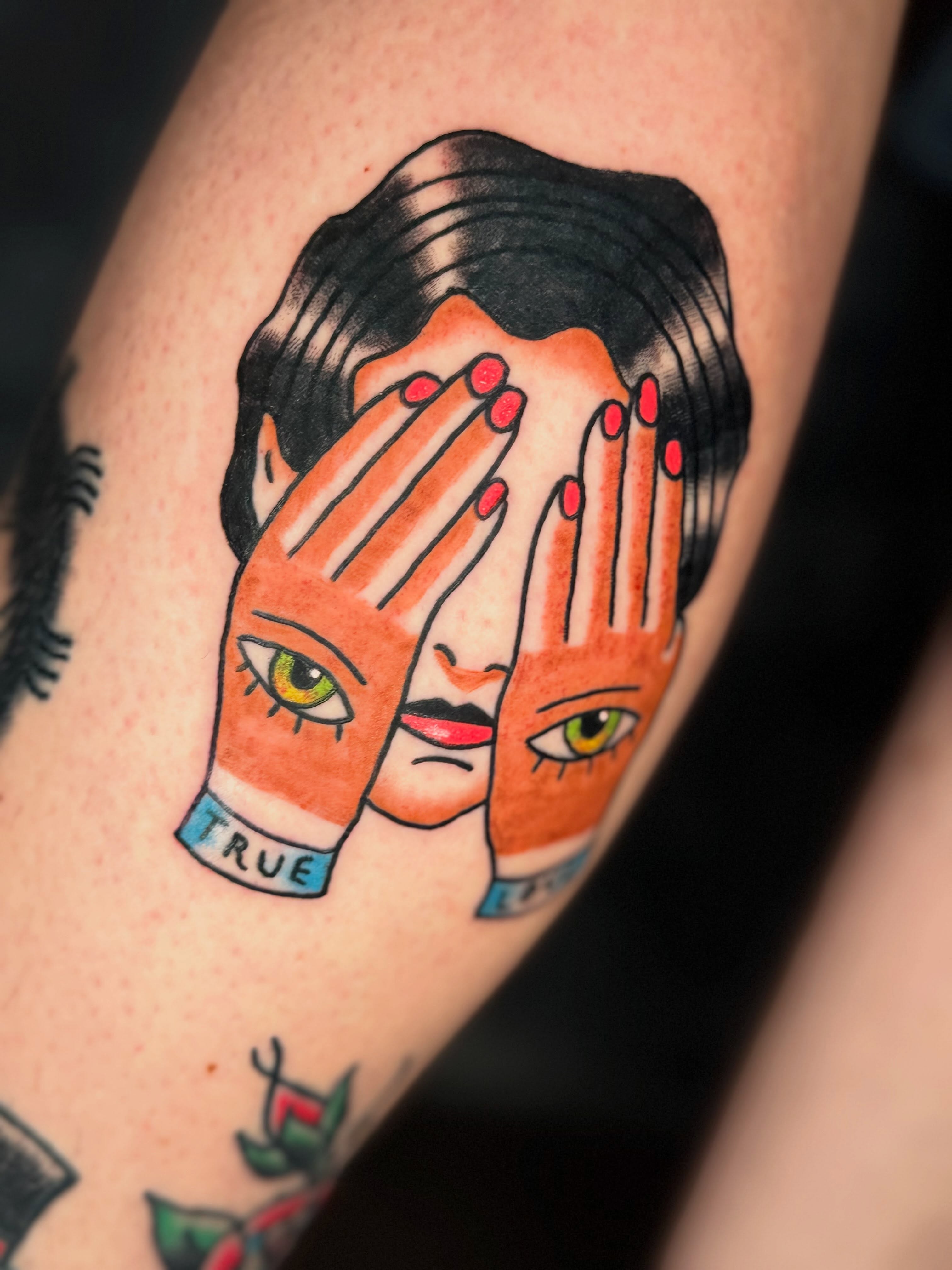Hands covering face American traditional tattoo on the forearm by Camilo