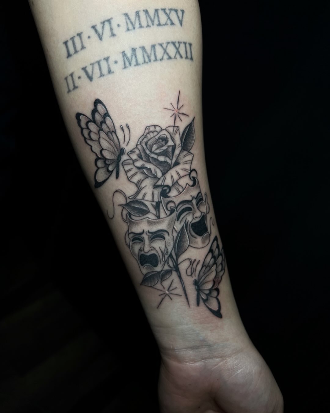 Rose and masks realism tattoo on the forearm by Iraymi Beltran
