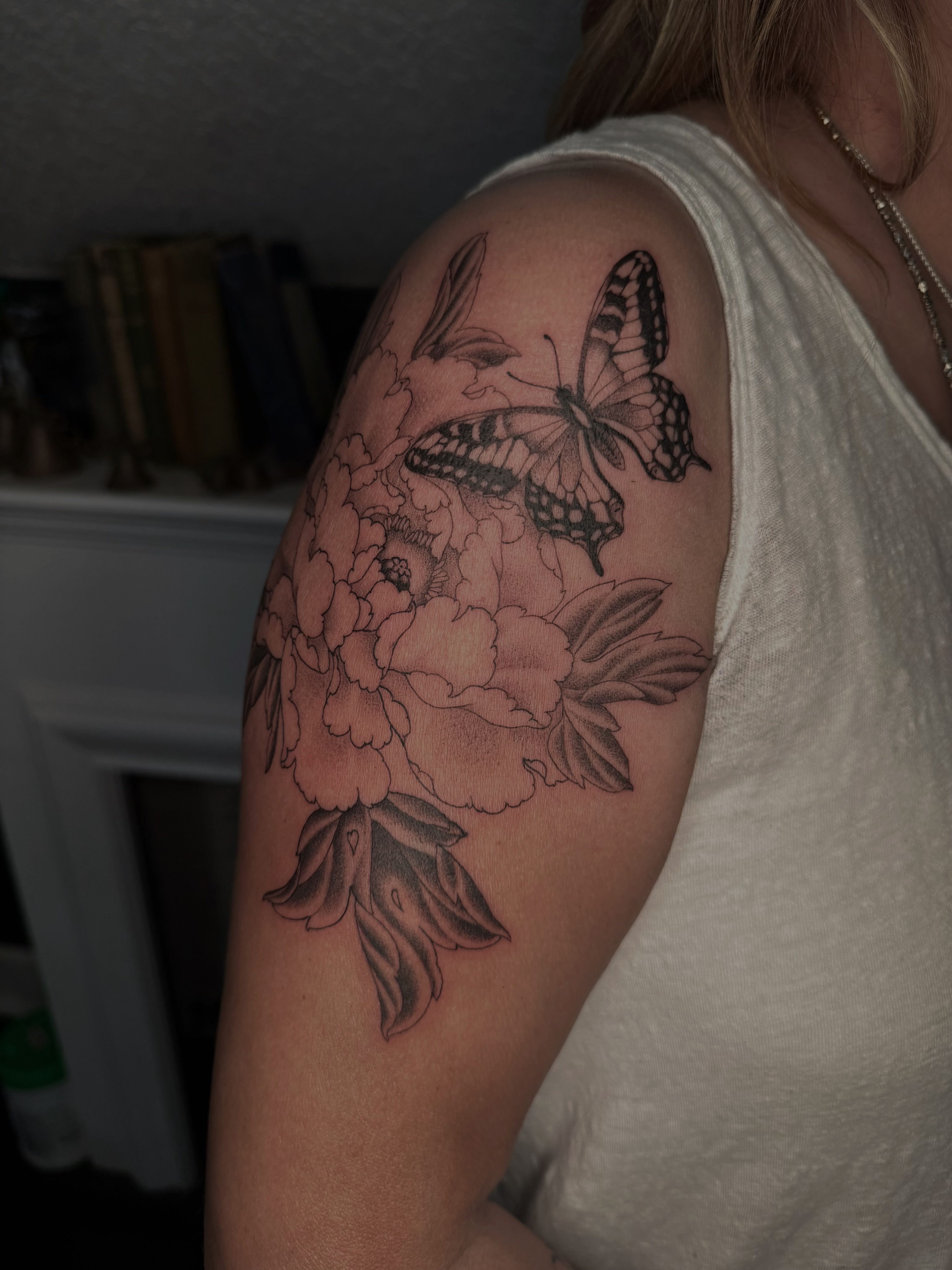 Butterfly and flowers black and grey tattoo on the shoulder by Virginia 🥀Neo Traditional