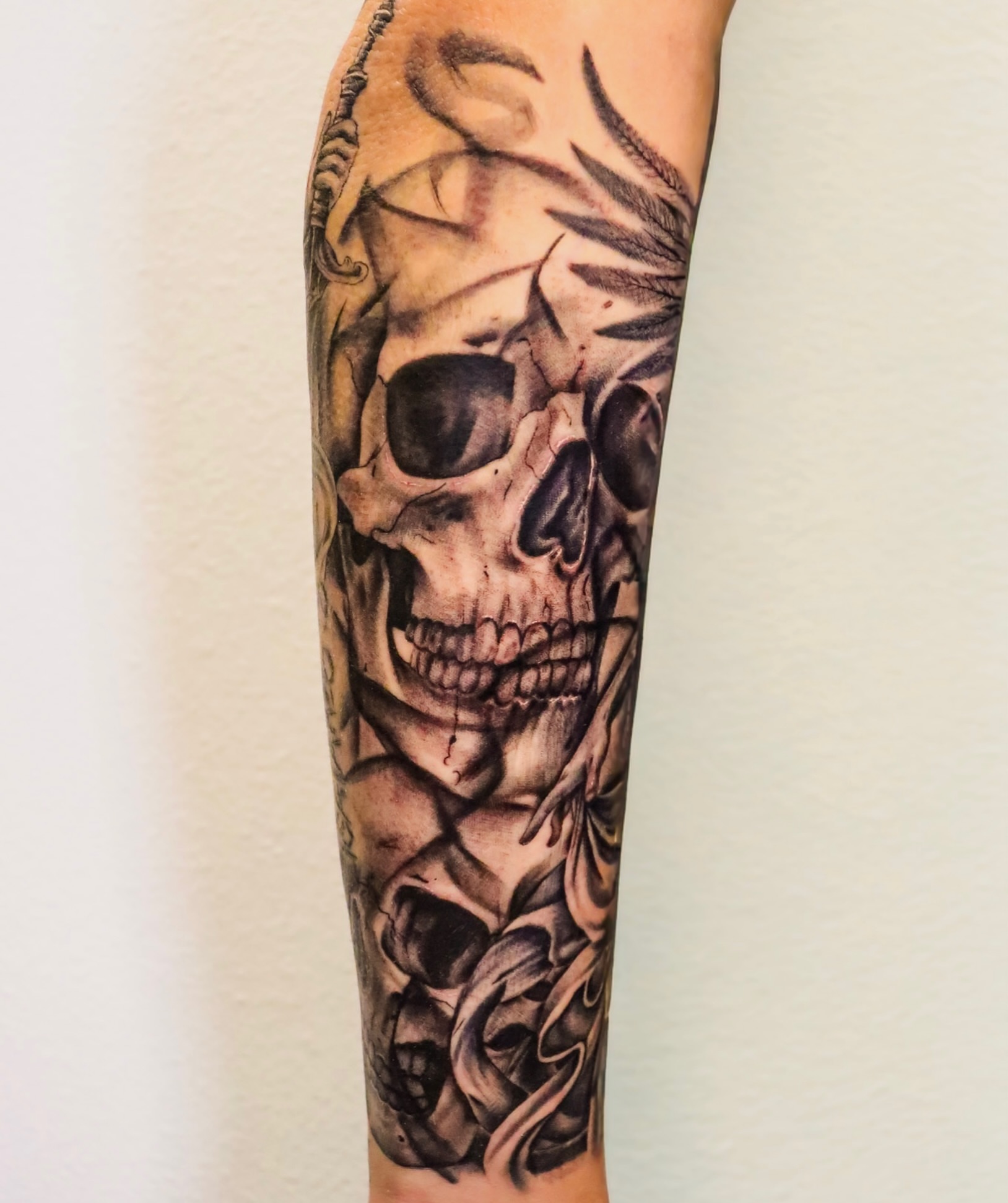 Skull realism tattoo on the forearm by Angel Tattoos
