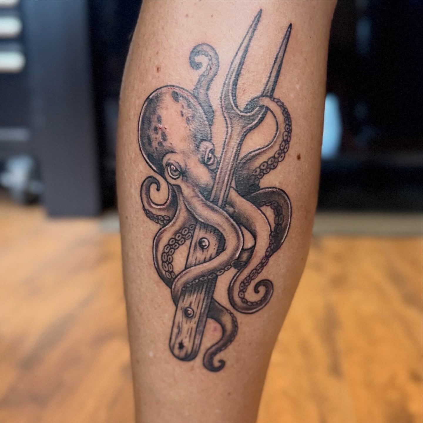 Octopus black and grey tattoo on the forearm by Chuckthegirl