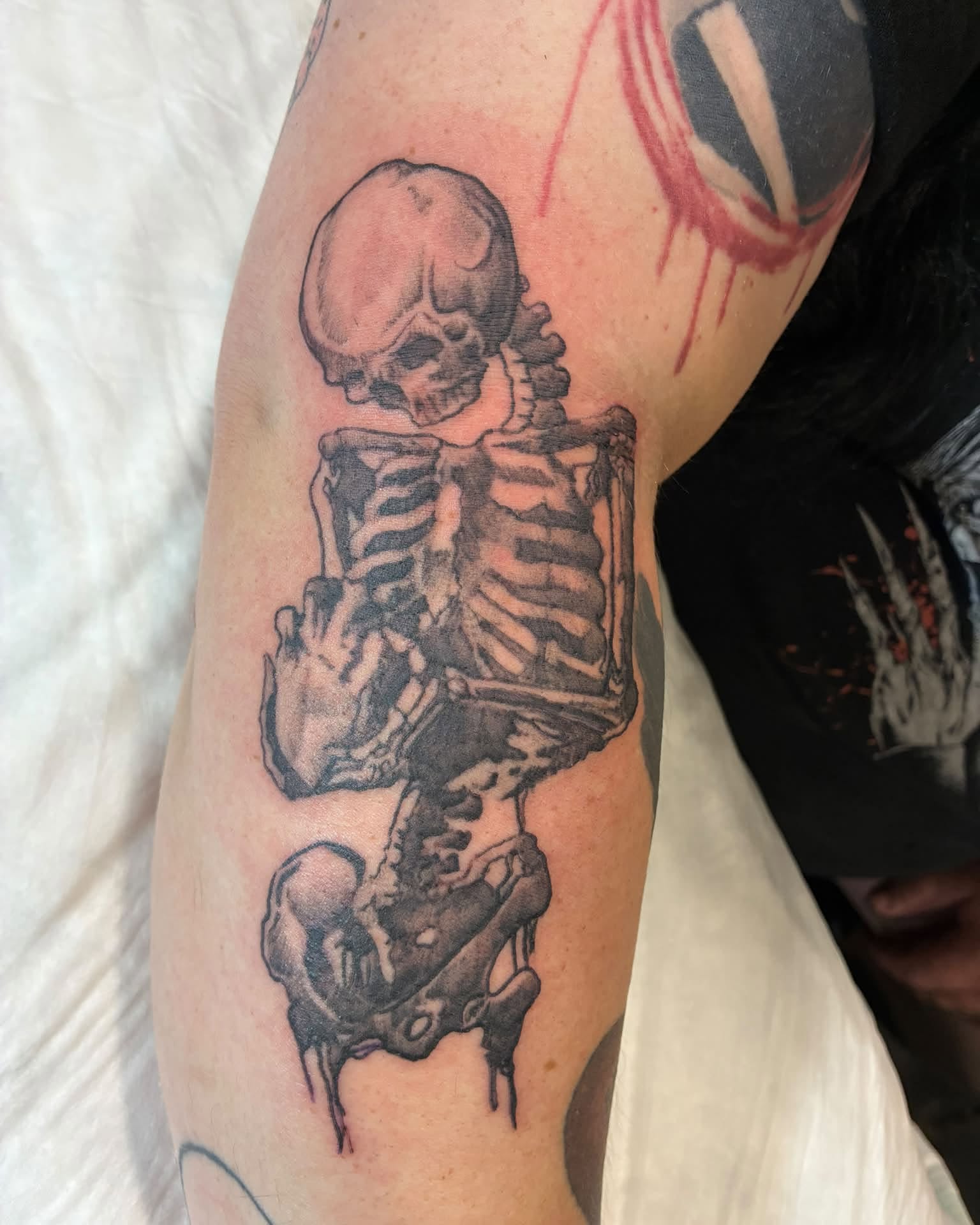 Skeleton black and grey tattoo on the forearm by Heather Freitag