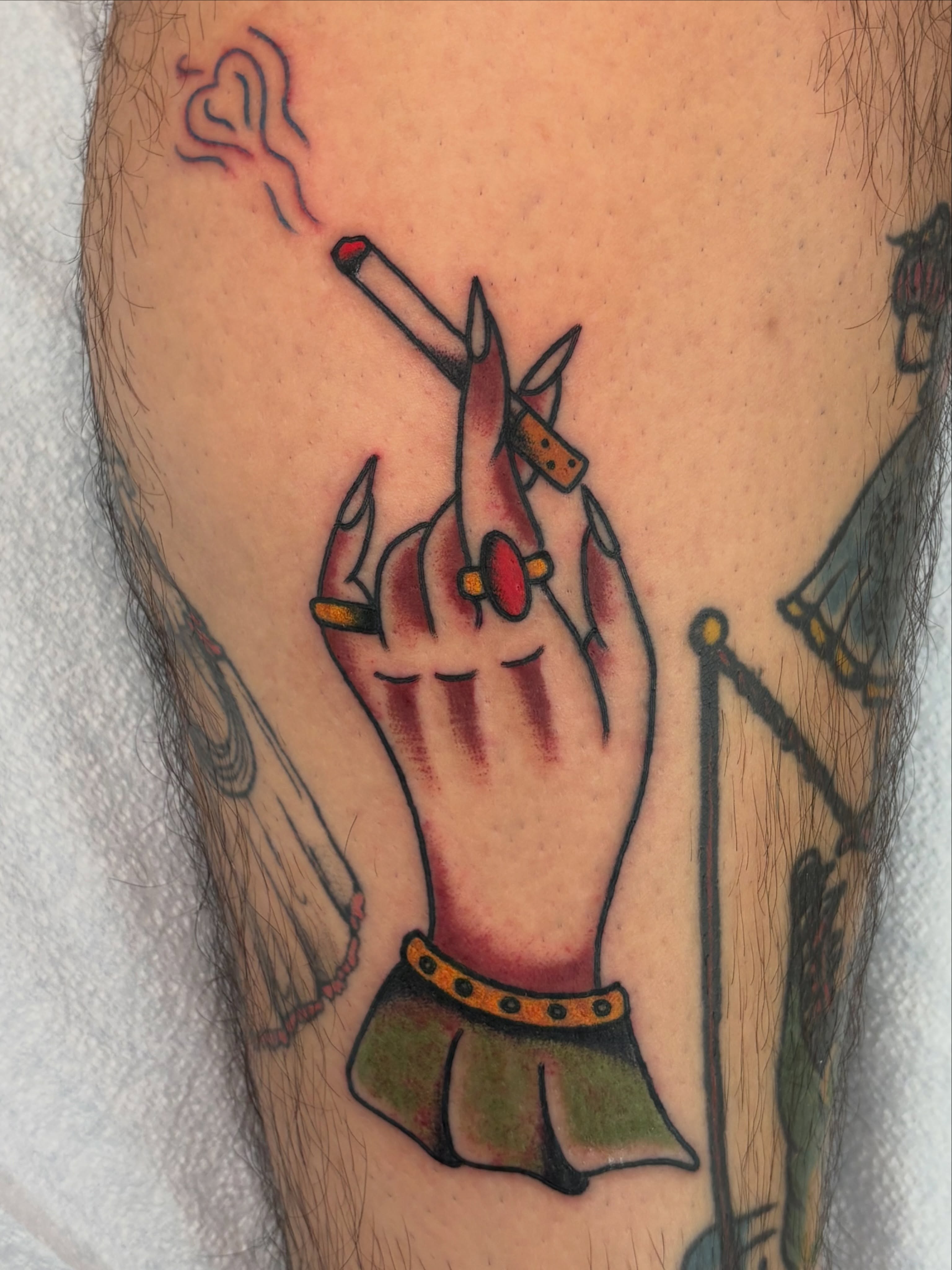Hand with cigarette American traditional tattoo on the forearm by Aysia Mankin-Wong, San Francisco, California