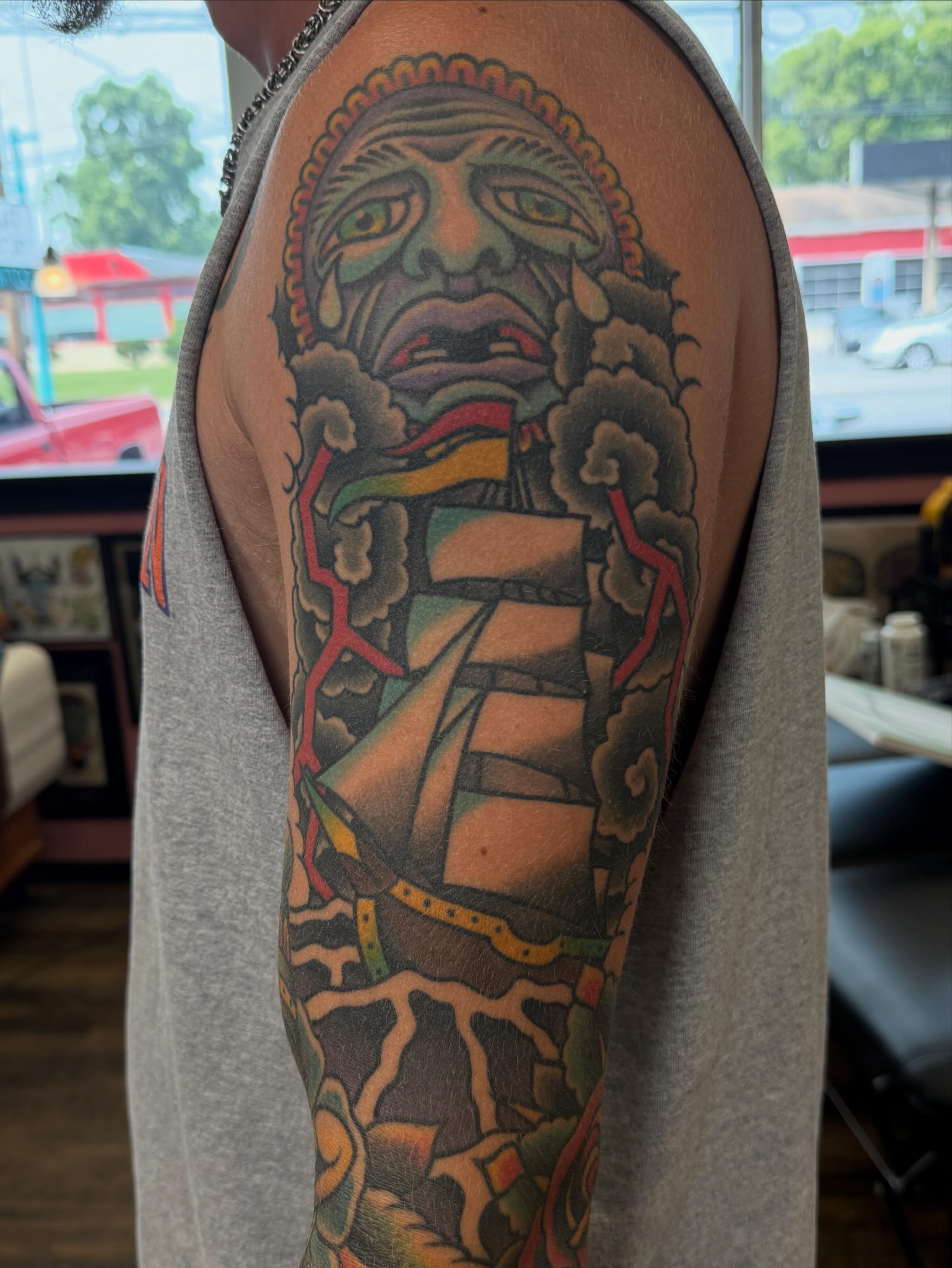 Indigenous warrior American traditional tattoo on the upper arm by Big Al