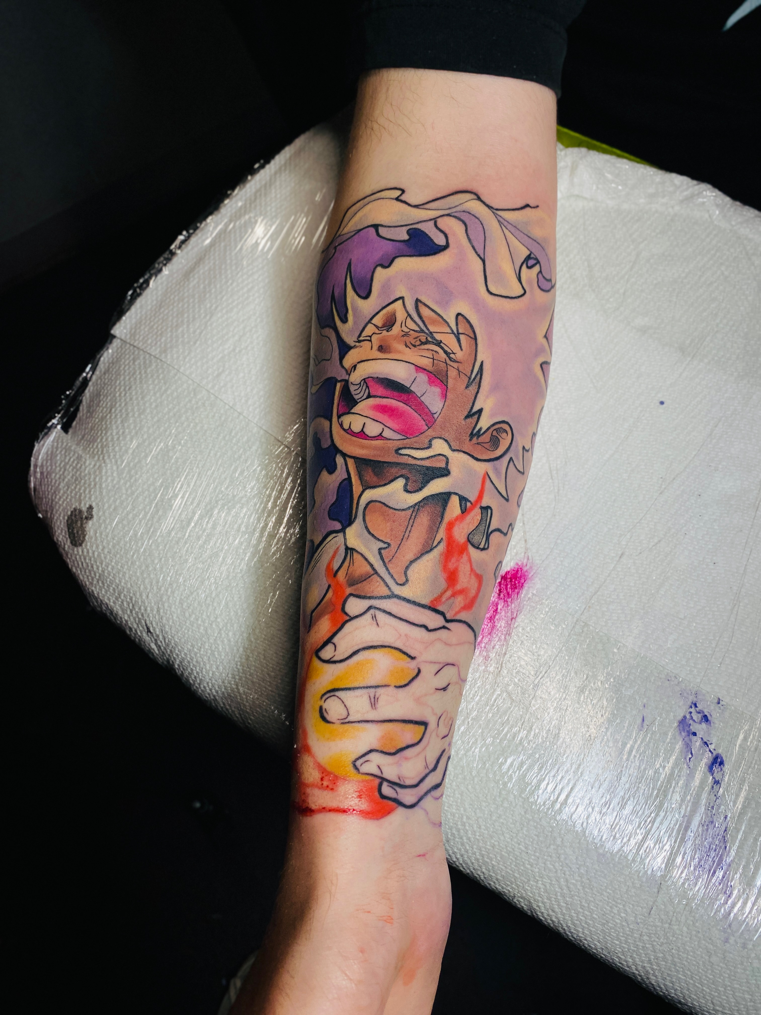 Angry character anime tattoo on the forearm by Kyle The Cartoon Guy