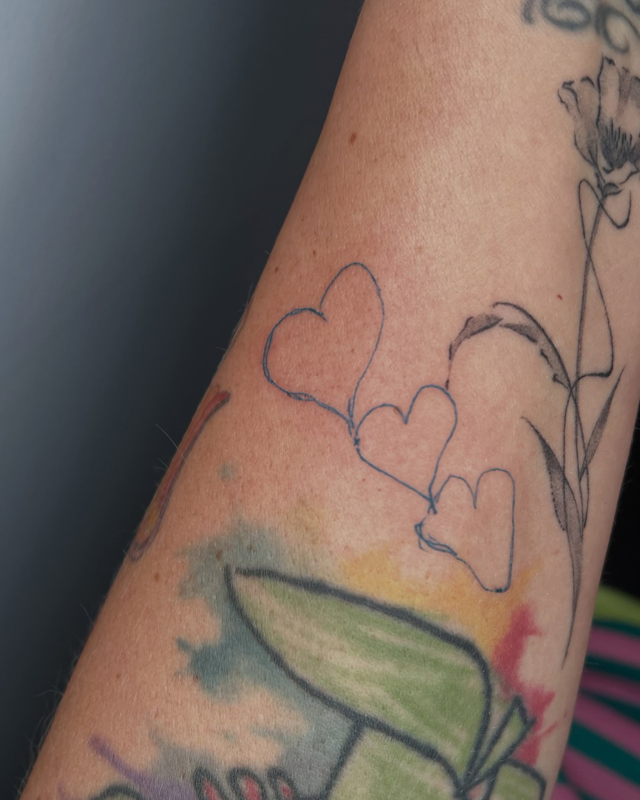 Hearts watercolor tattoo on the forearm by ๐ฆ๐๐๐ก ๐ฆ๐๐๐