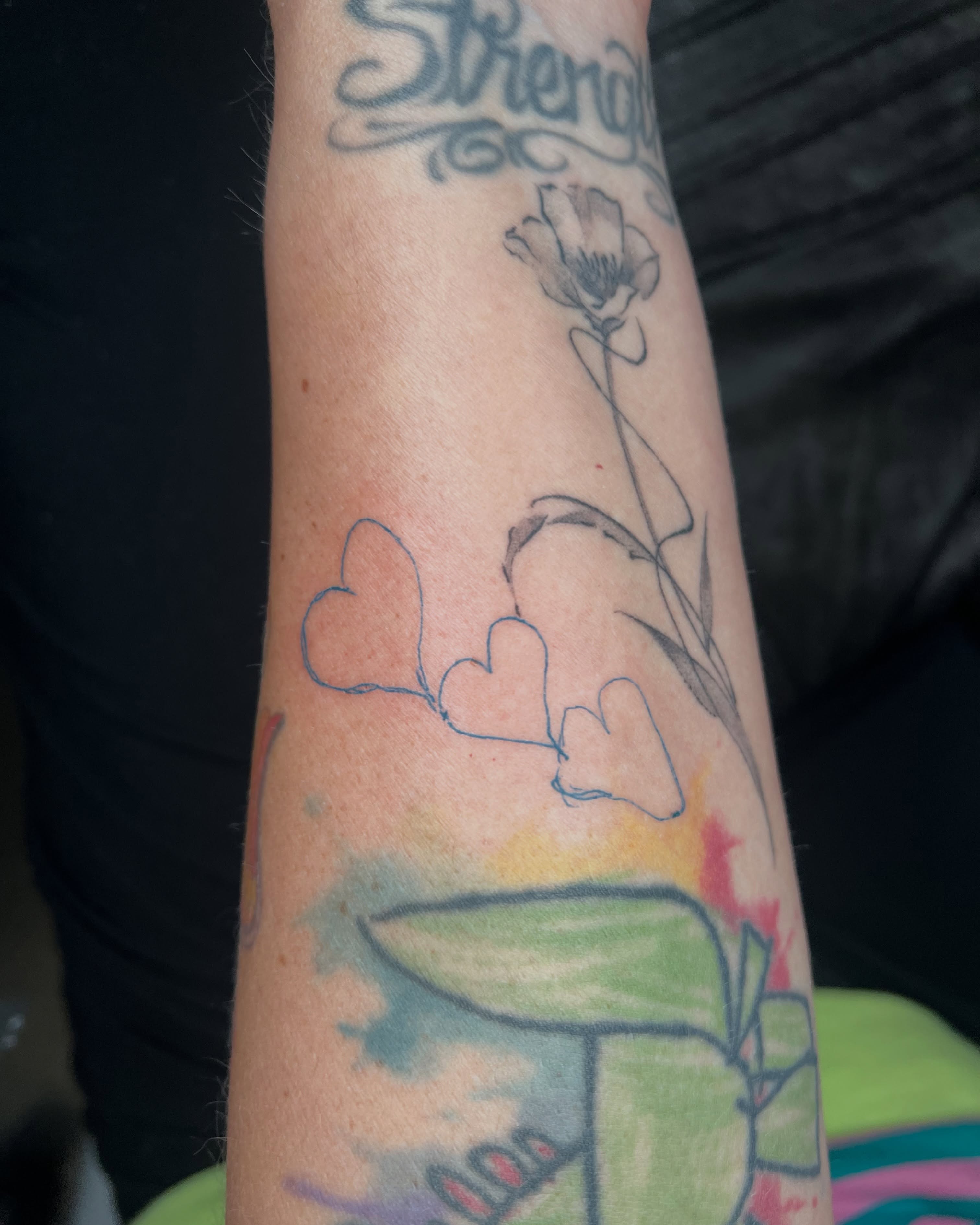 Flower and hearts watercolor tattoo on the forearm by ๐ฆ๐๐๐ก ๐ฆ๐๐๐