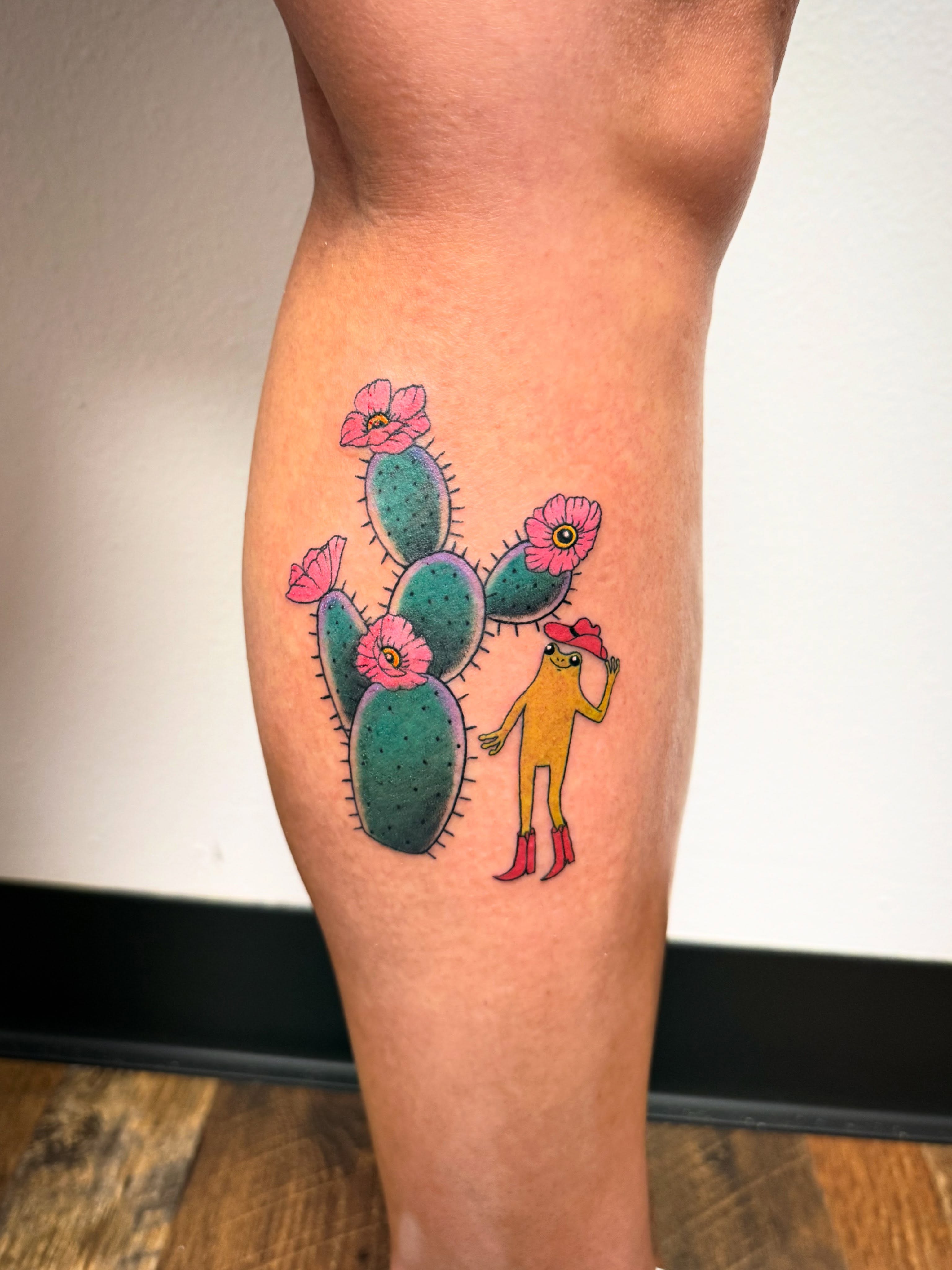 Cactus and anthropomorphic figure dotwork tattoo on the thigh by KT
