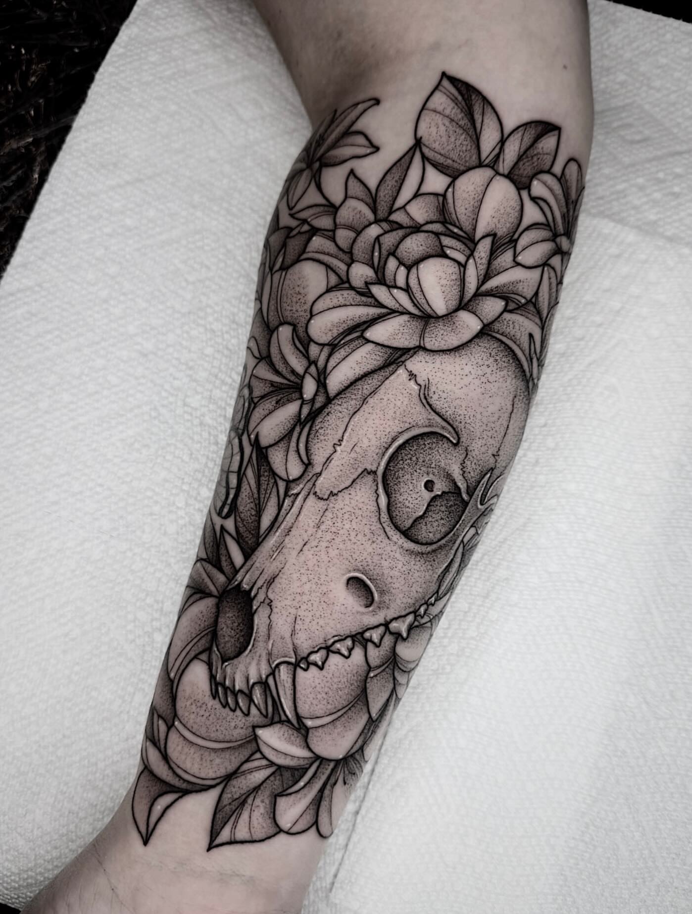 Skull and flowers dotwork tattoo on the forearm by 𝔅𝔯𝔦 𝔉𝔩𝔢𝔱𝔠𝔥𝔢𝔯