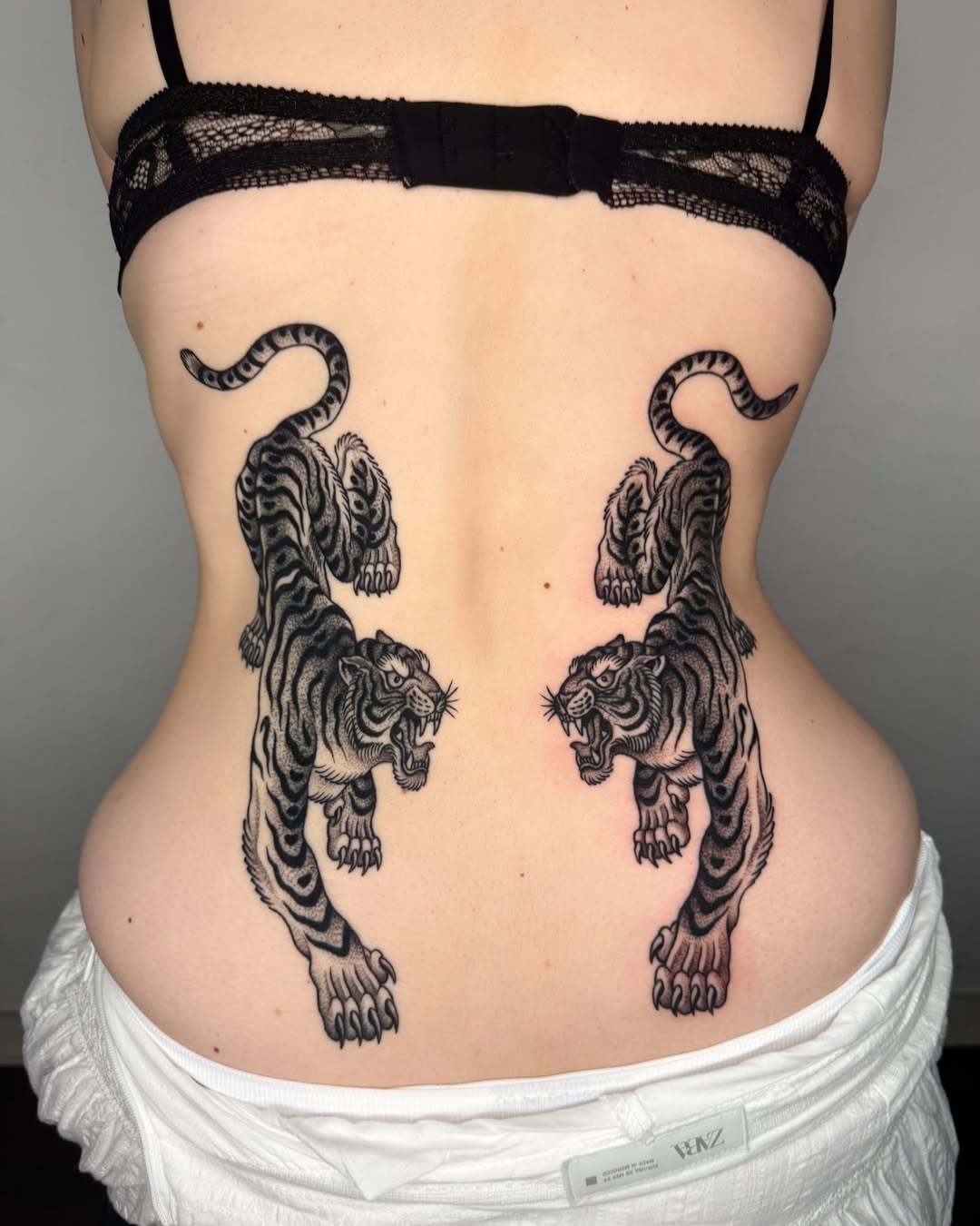 Tigers black and grey tattoo on the back by Jae Traditional Tattoo