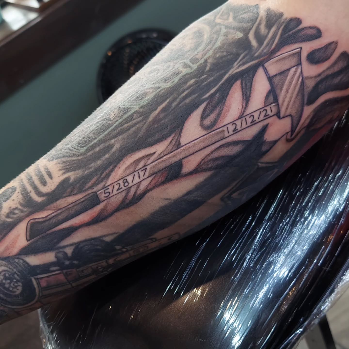 Motorcycle rider realism tattoo on the forearm by Kari Rhoades, Marion, Iowa