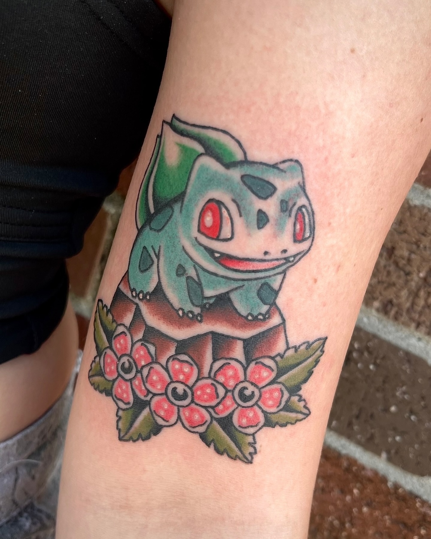 Bulbasaur American traditional tattoo on the forearm by Tiffani Thompson, San Diego, California