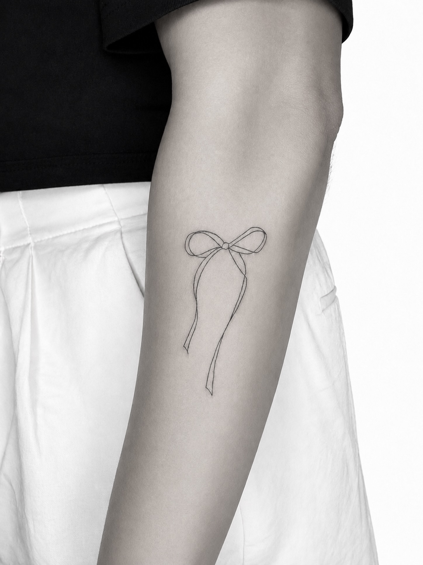 Bow fine line tattoo on the forearm by Tattoo Artist & Piercer ▪️alona Zamsh