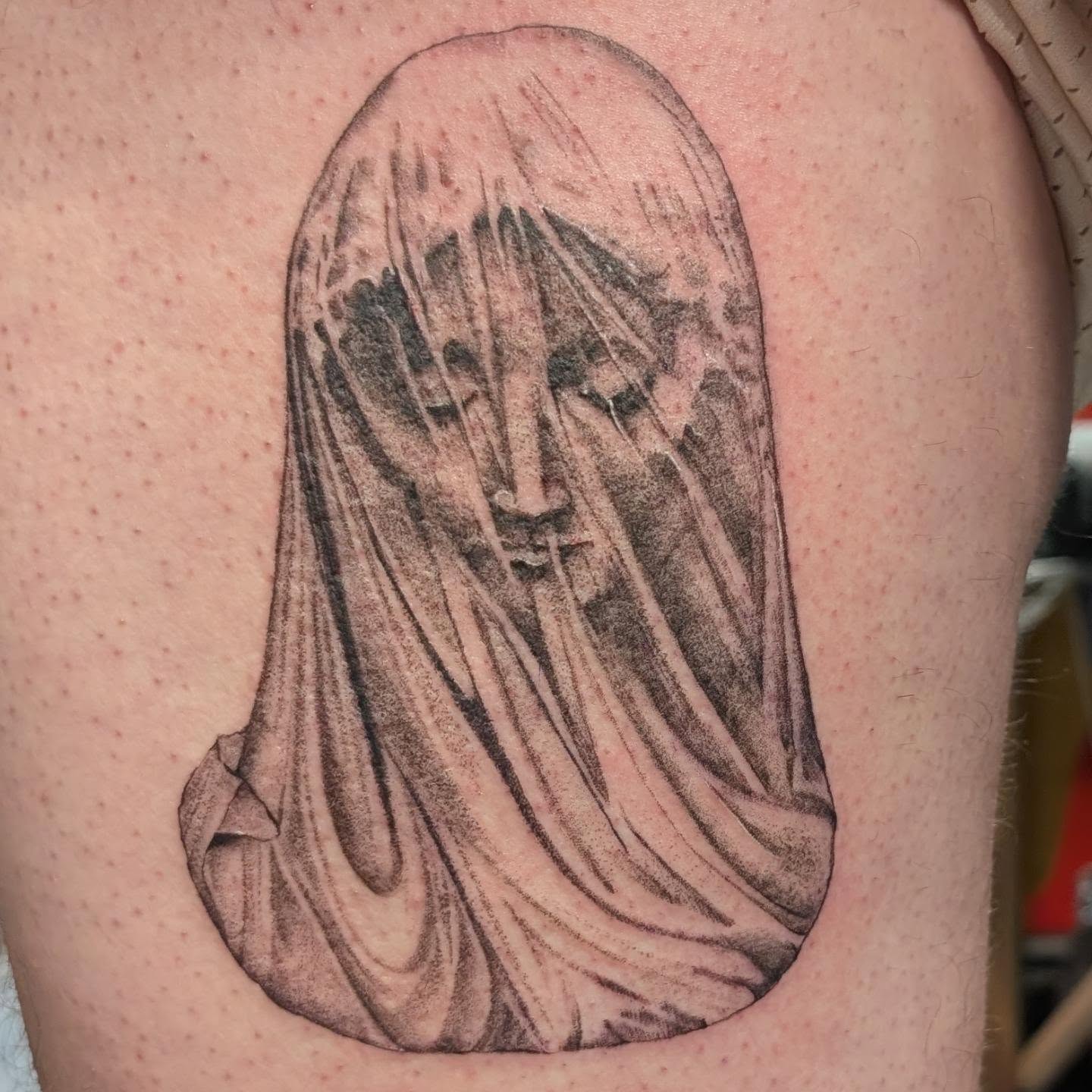 Veiled figure dotwork tattoo on the thigh by Arminda Walborn