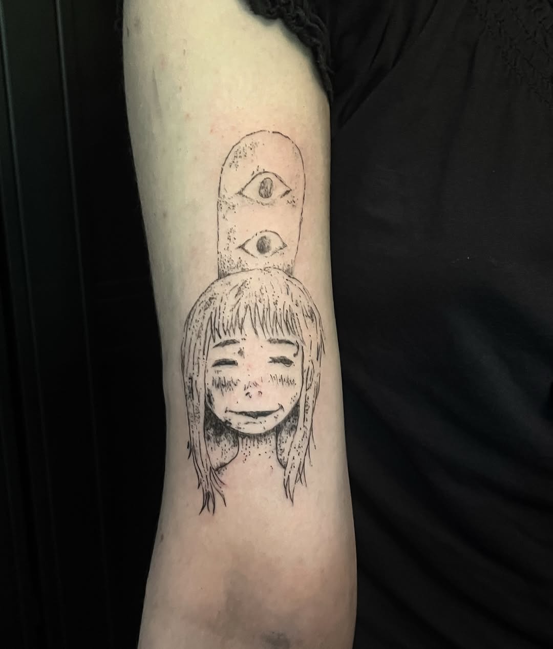 Child's face dotwork tattoo on the forearm by kacper