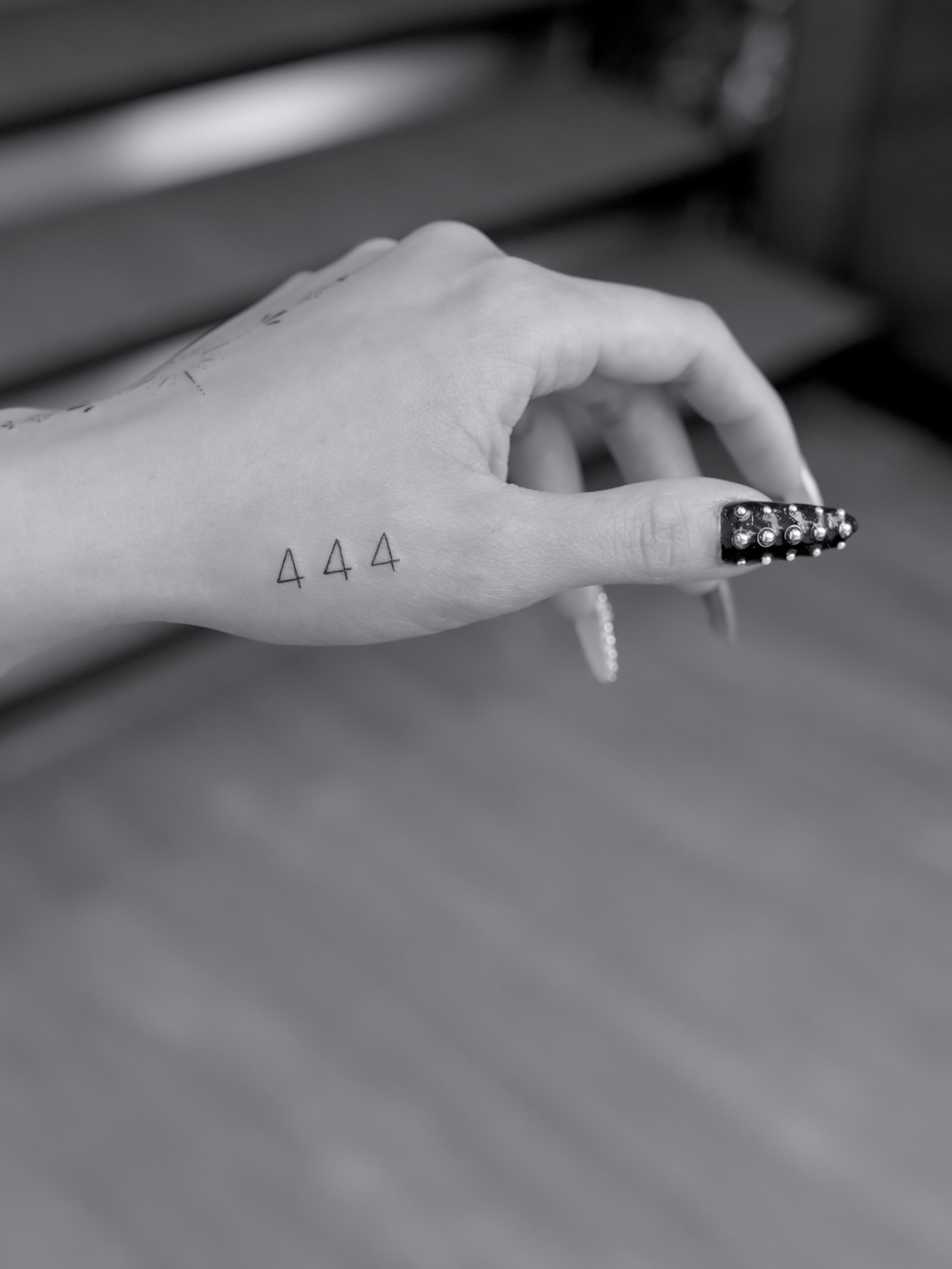 Numbers black and grey tattoo on the hand by Julia