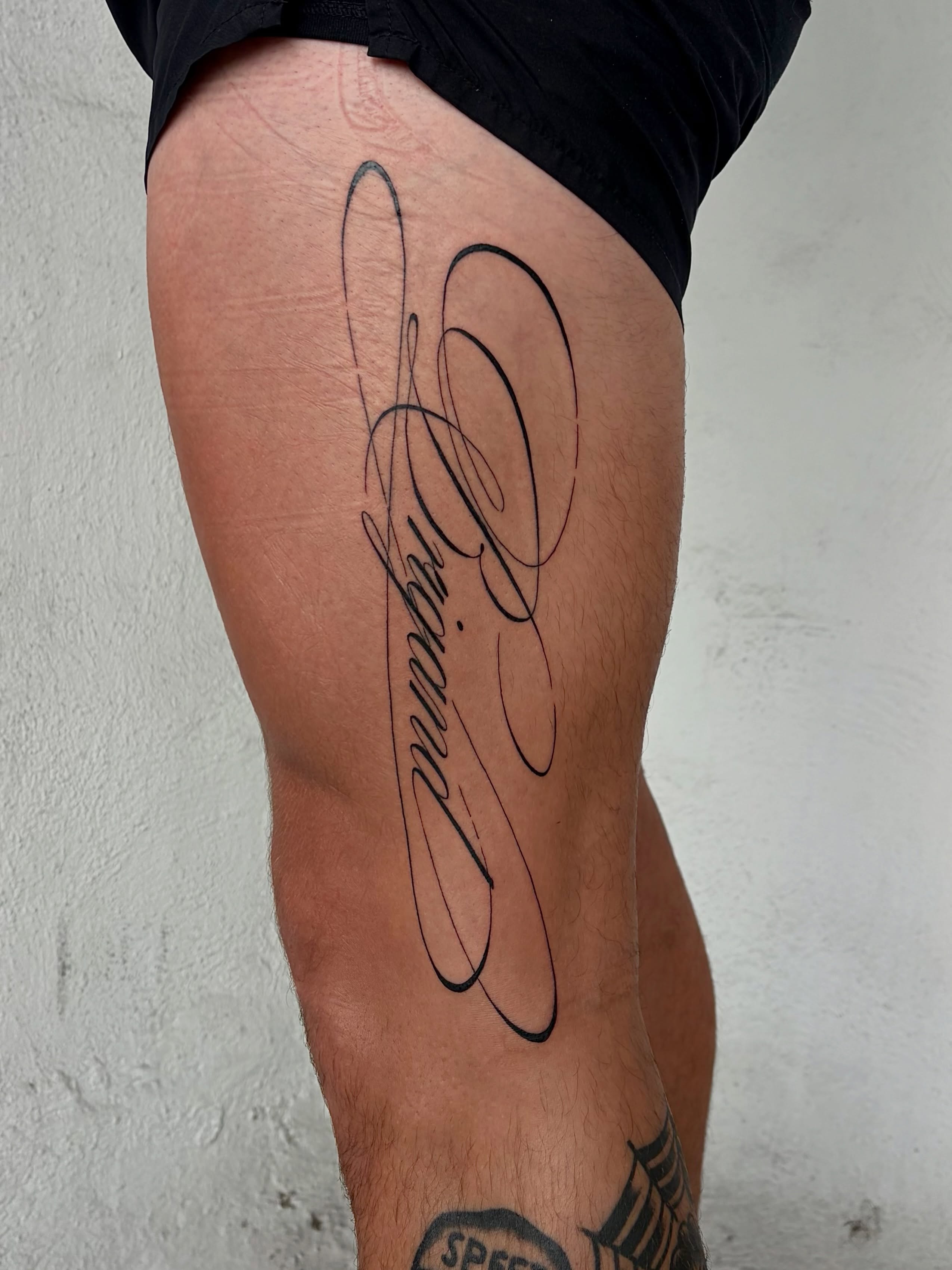 Script lettering lettering script tattoo on the leg by Kylah Amin Tattoo