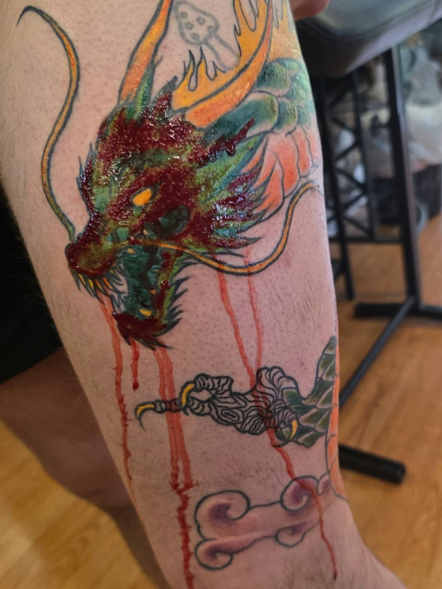 Dragon and warrior American traditional tattoo on the forearm by julian