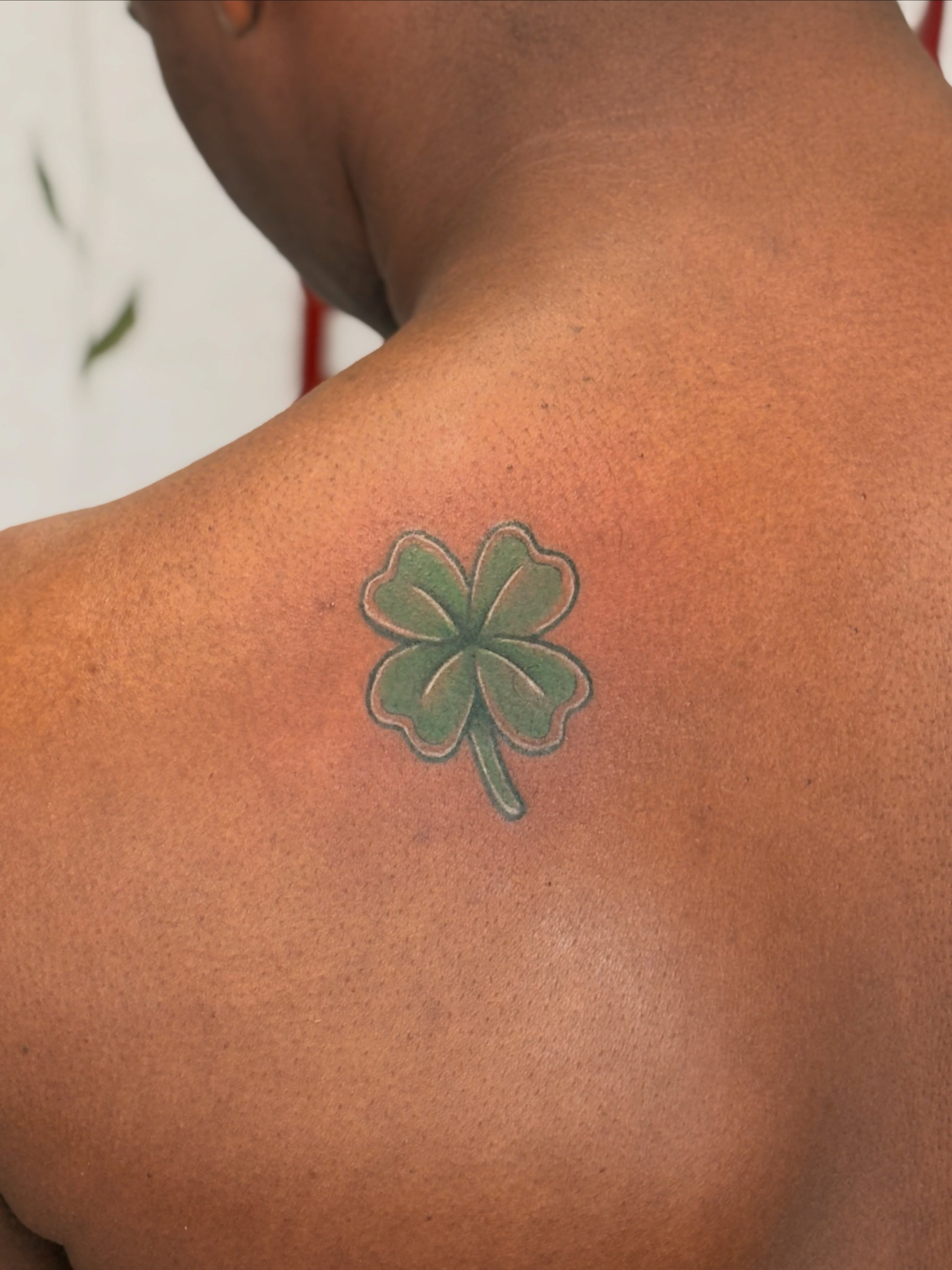 Four-leaf clover American traditional tattoo on the back by CJ
