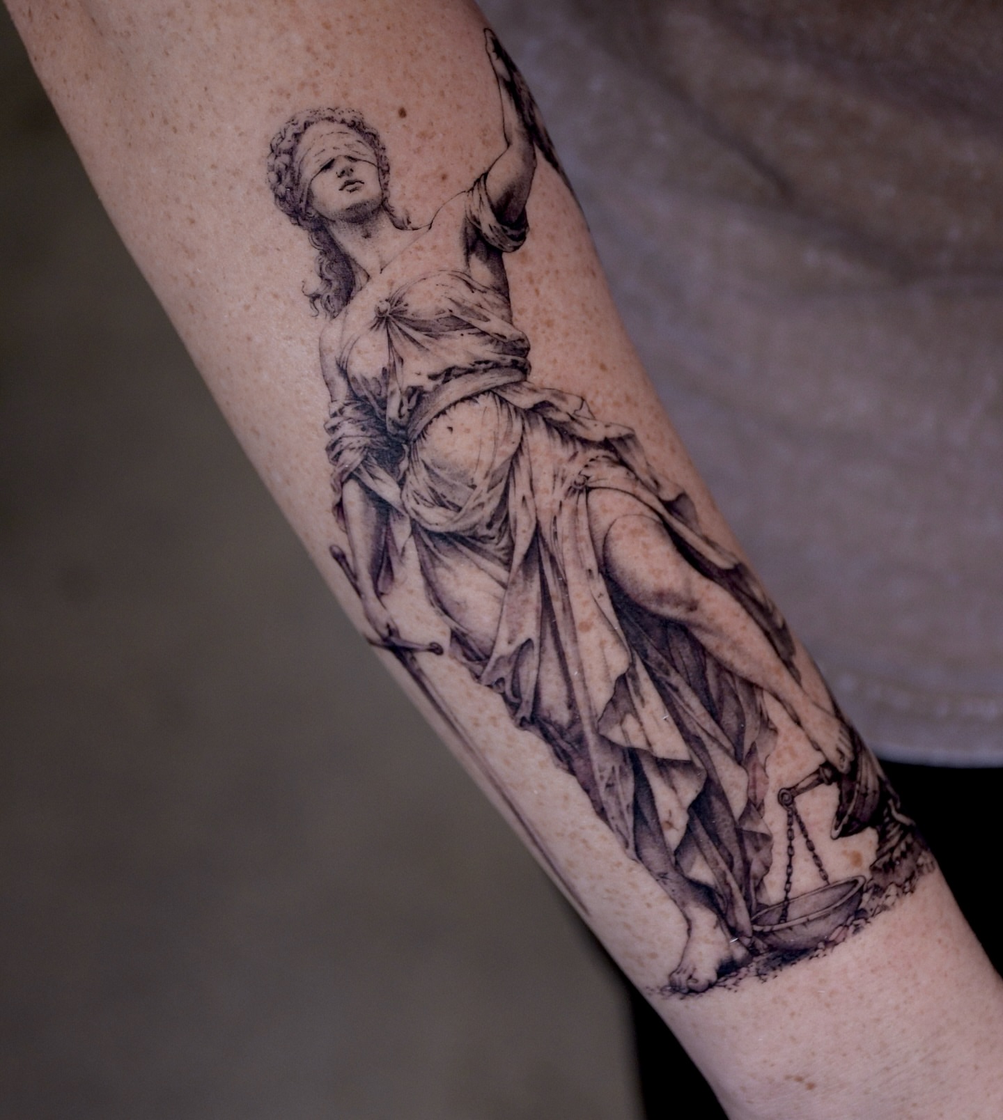 Statue of lady justice realism tattoo on the forearm by Gary Zhong, Upland, California