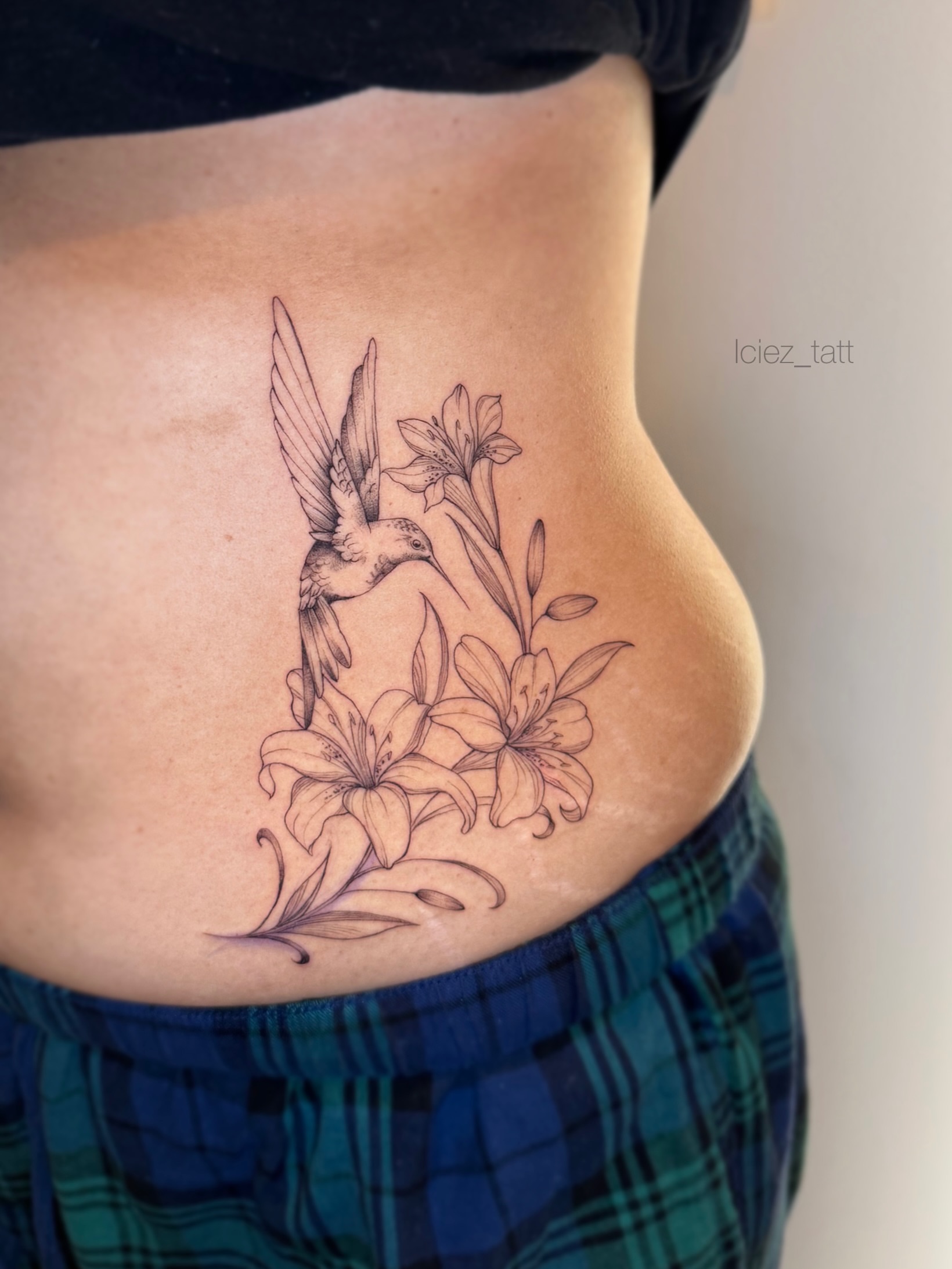 Bird and lilies black and grey tattoo on the ribs by Iciez