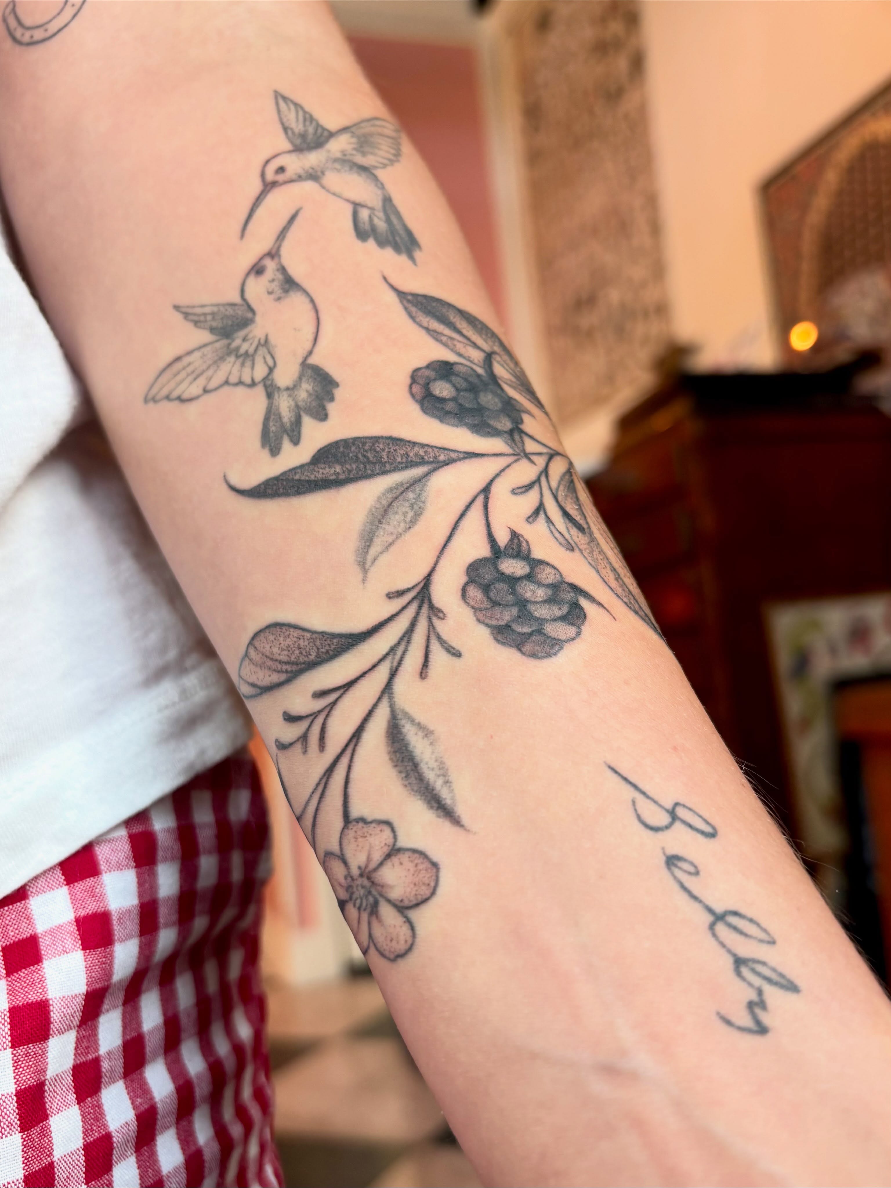 Birds and floral black and grey tattoo on the forearm by Leah Leinani