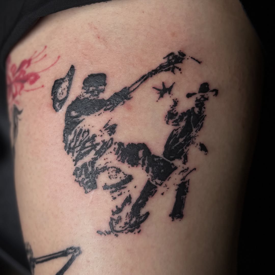 Cowboy duel black and grey tattoo on the upper arm by 🌸Blossom🌸