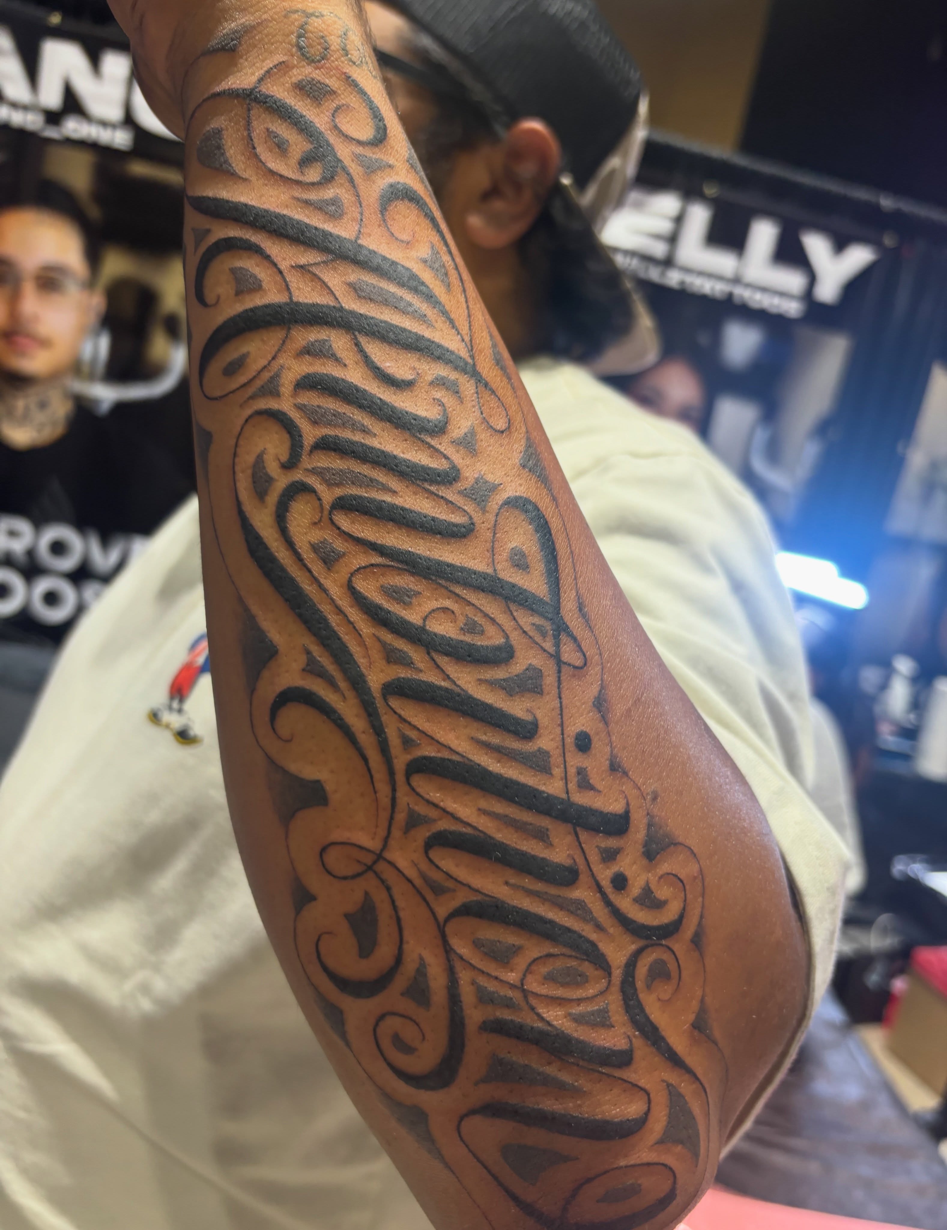 Script lettering lettering script tattoo on the forearm by Cristiano Ochoa, Elk Grove, California
