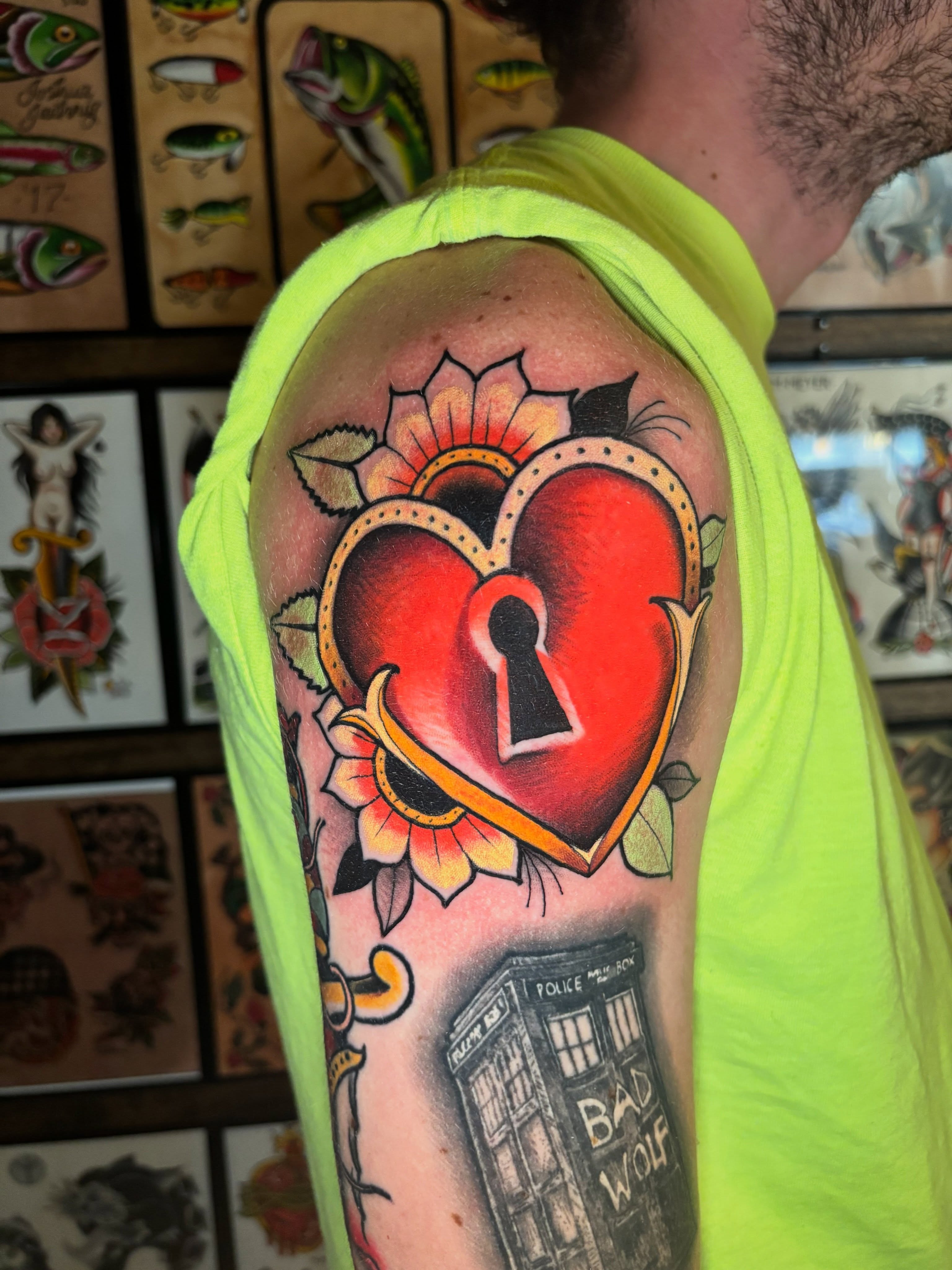 Heart with keyhole American traditional tattoo on the upper arm by Matt Stolzenburg