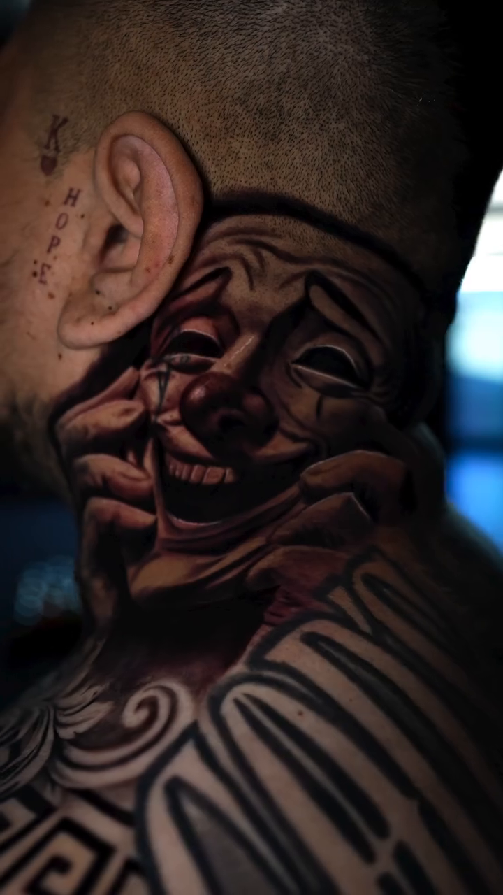 Laughing and crying masks realism tattoo by Jose Mendoza Torres