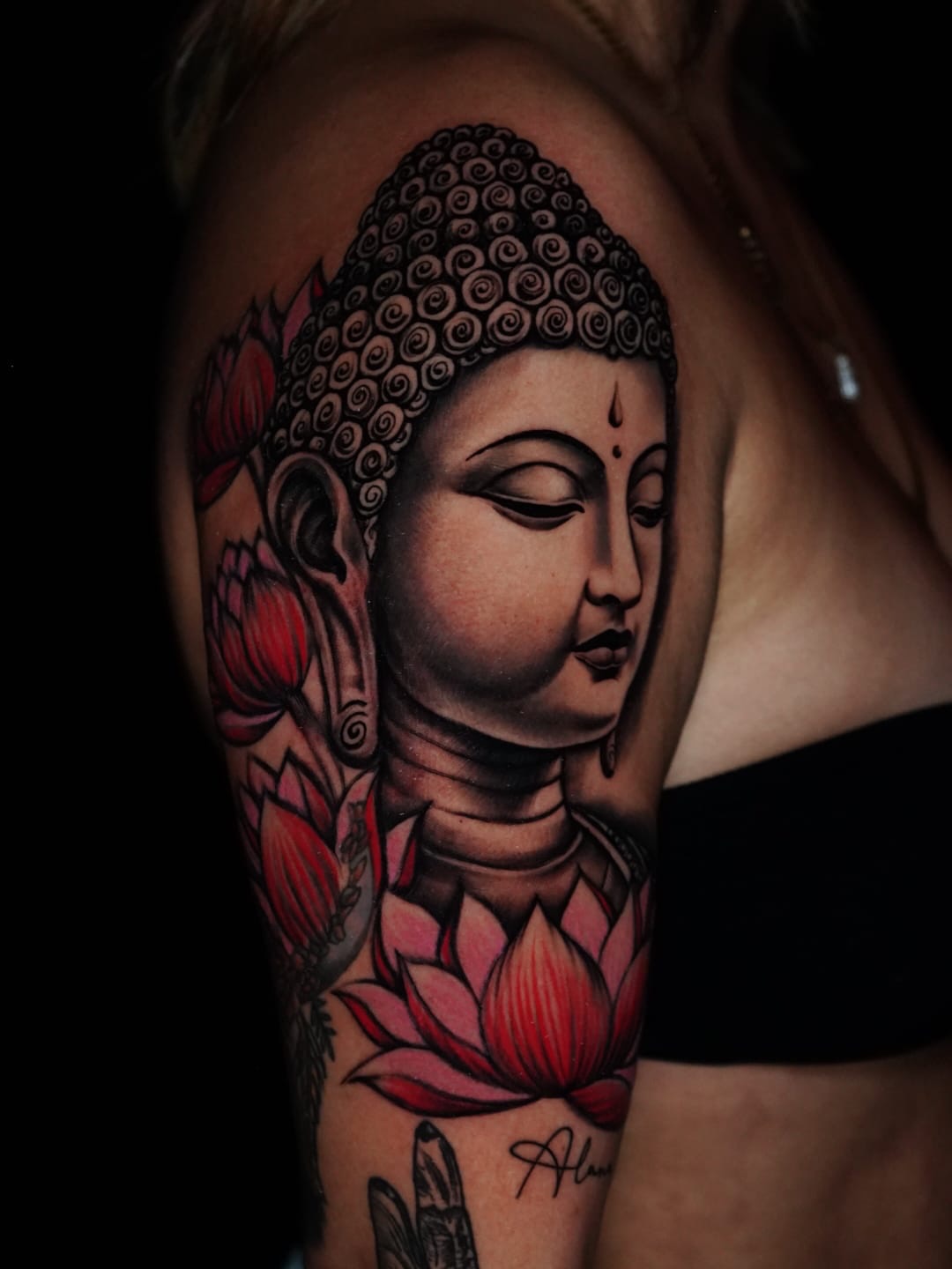 Buddha head realism tattoo on the shoulder by Alex