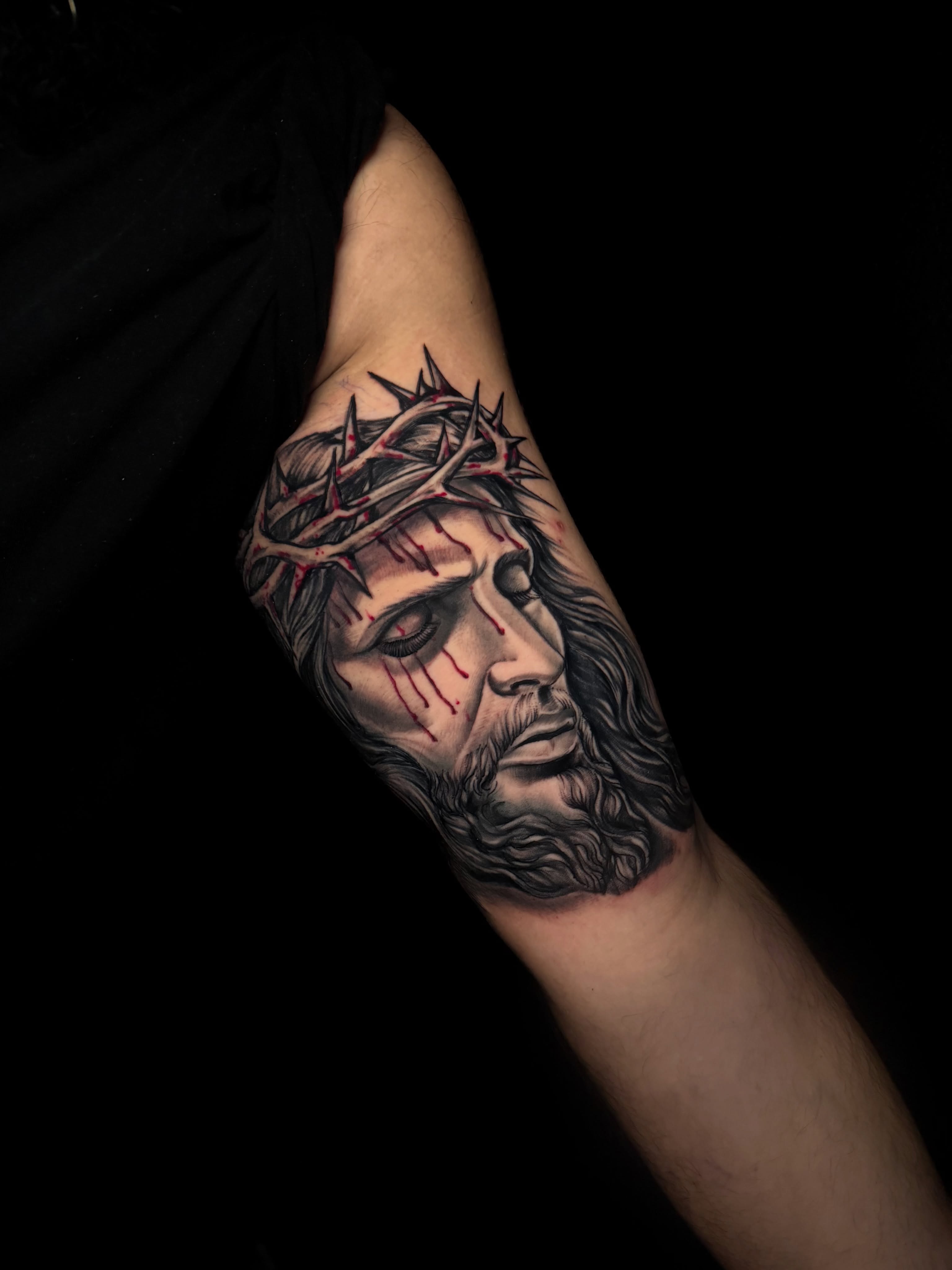 Jesus Christ realism tattoo on the forearm by Alex
