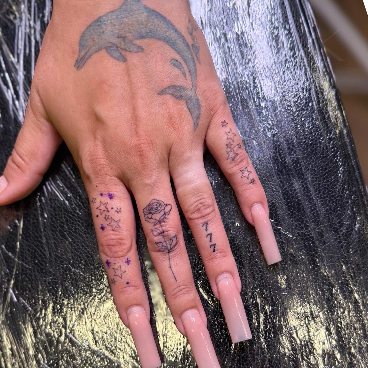 Dolphins and stars dotwork tattoo on the hand by PxINK, Crystal, Minnesota