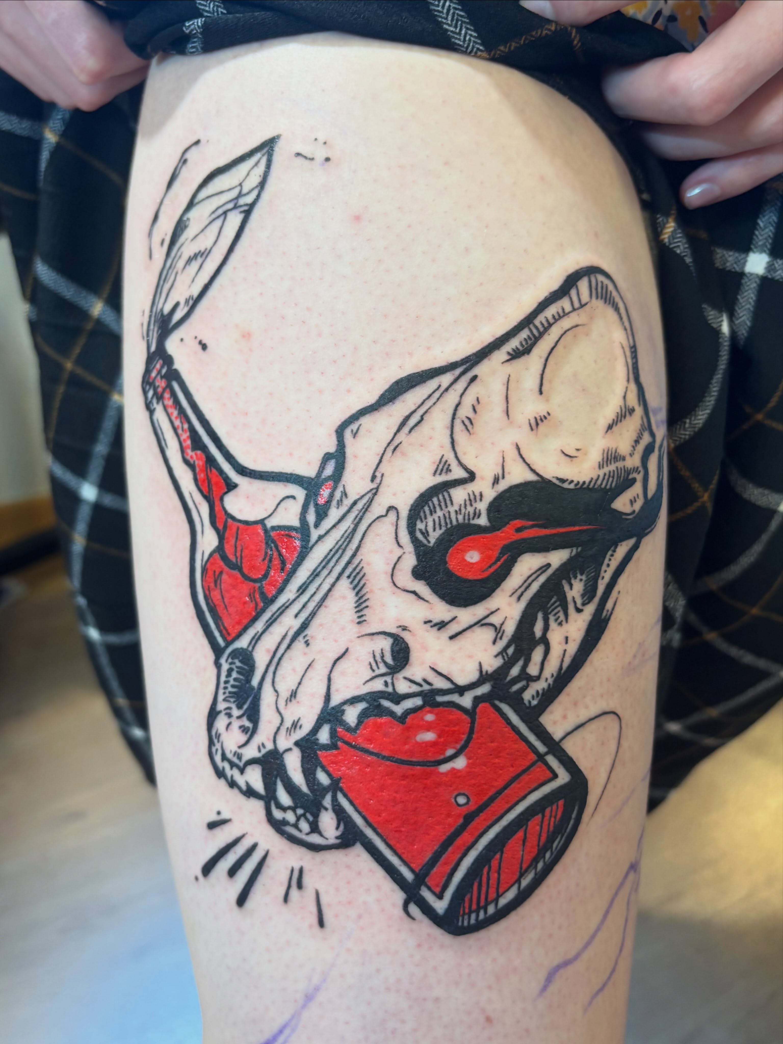 Bull skull with heart American traditional tattoo on the thigh by Zoe Brookes