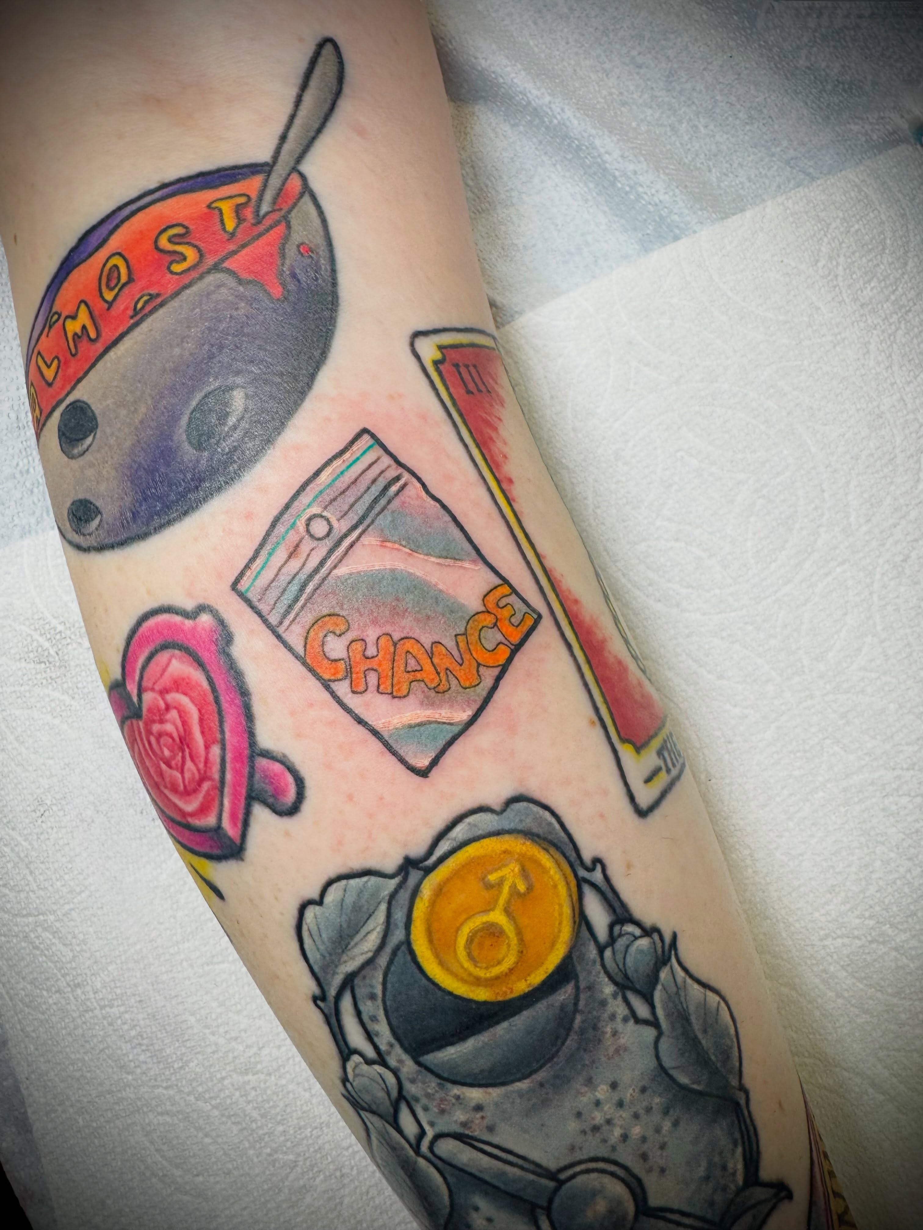 Tea cup and fortune teller cards American traditional tattoo on the forearm by San Diego Tattoo Artist