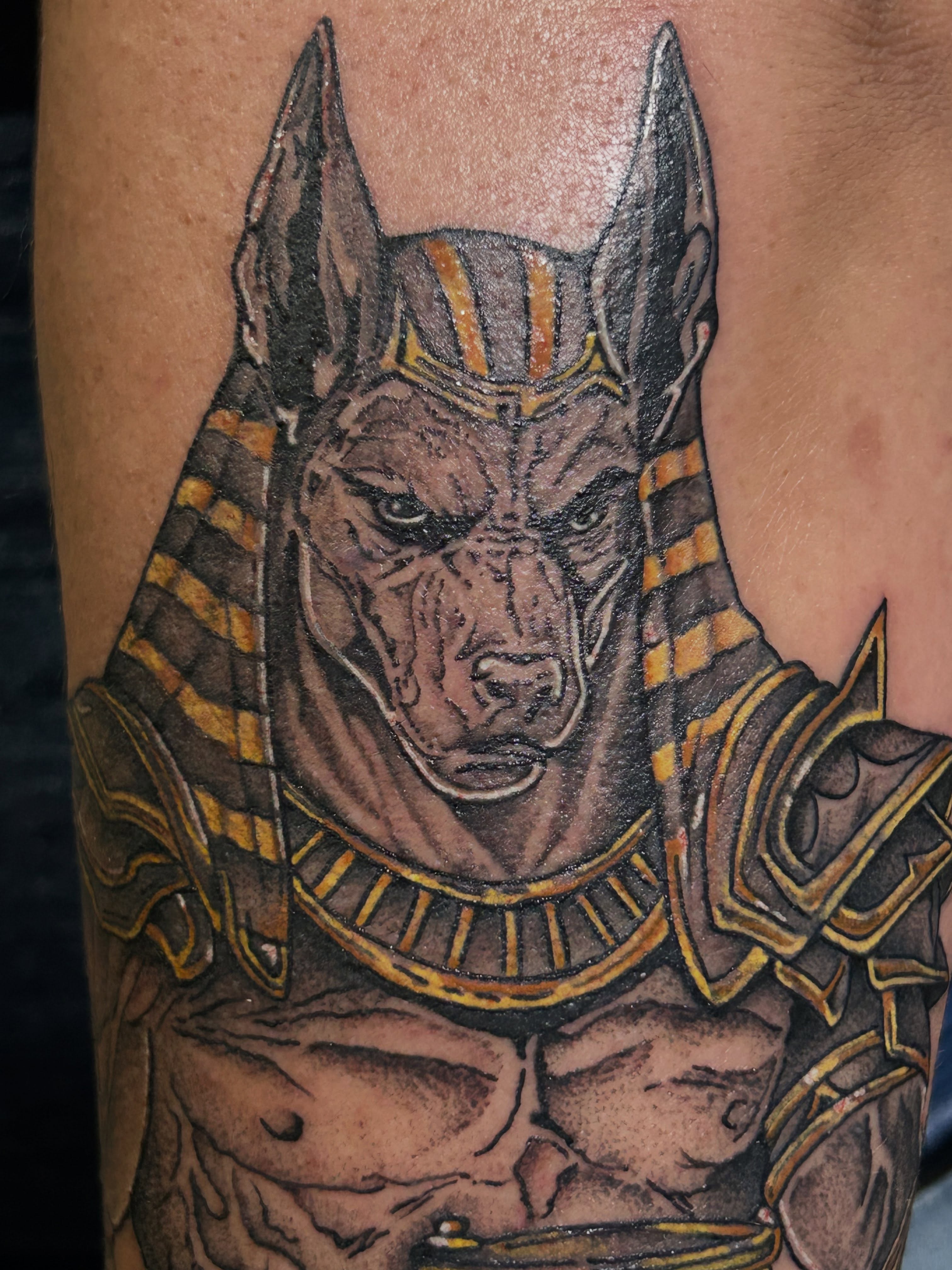 Ancient Egyptian god realism tattoo on the forearm by Barro