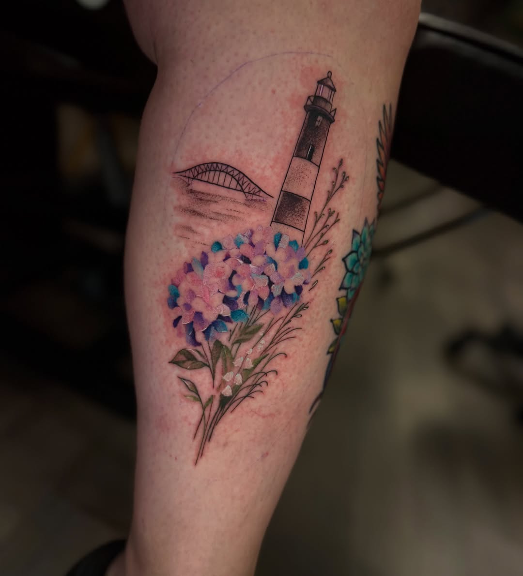 Lighthouse and flowers dotwork tattoo on the forearm by Ray De Leon