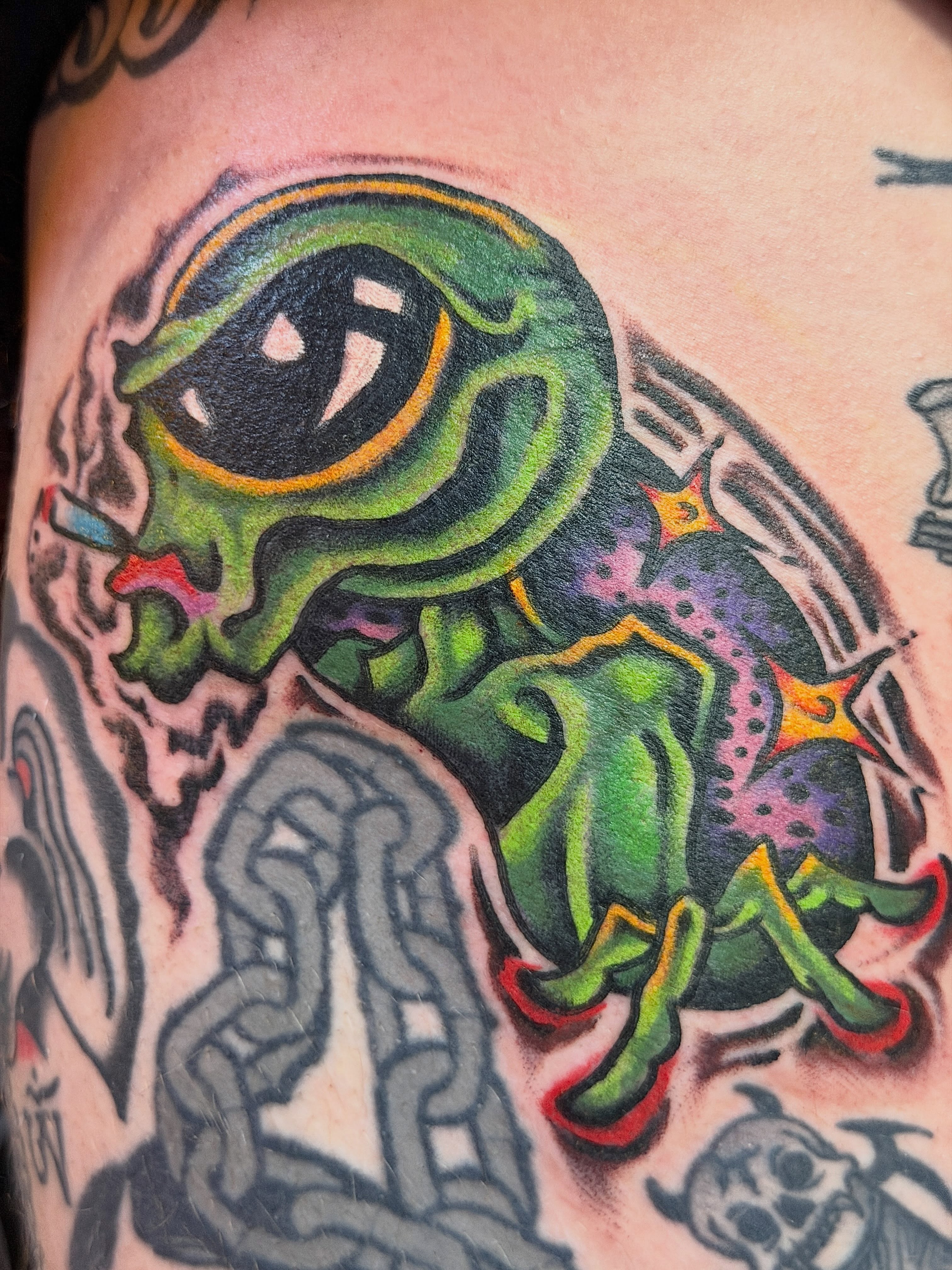 Frog American traditional tattoo on the upper arm by Joshua Speight