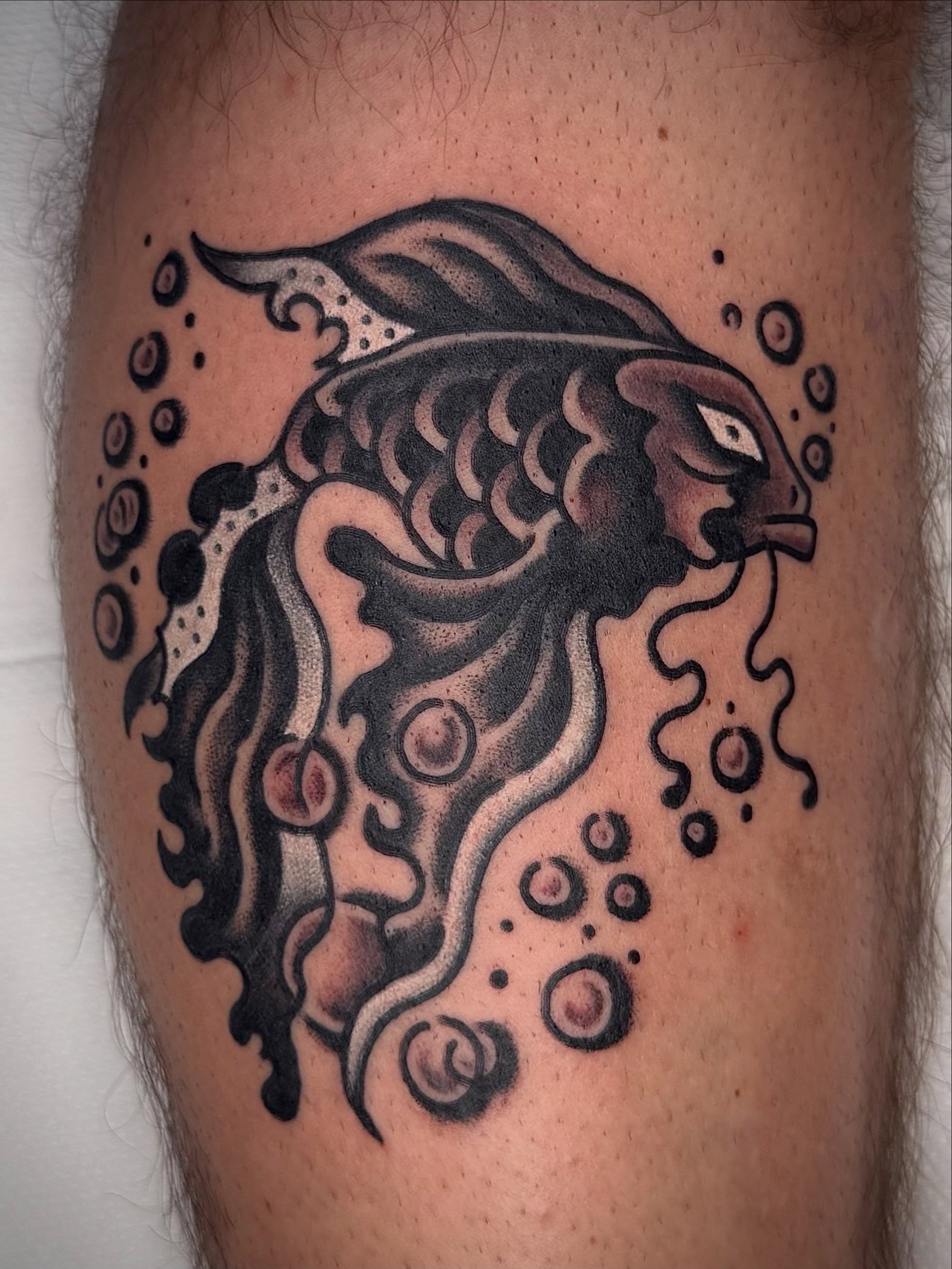 Fish dotwork tattoo on the thigh by Maximilian Harrison