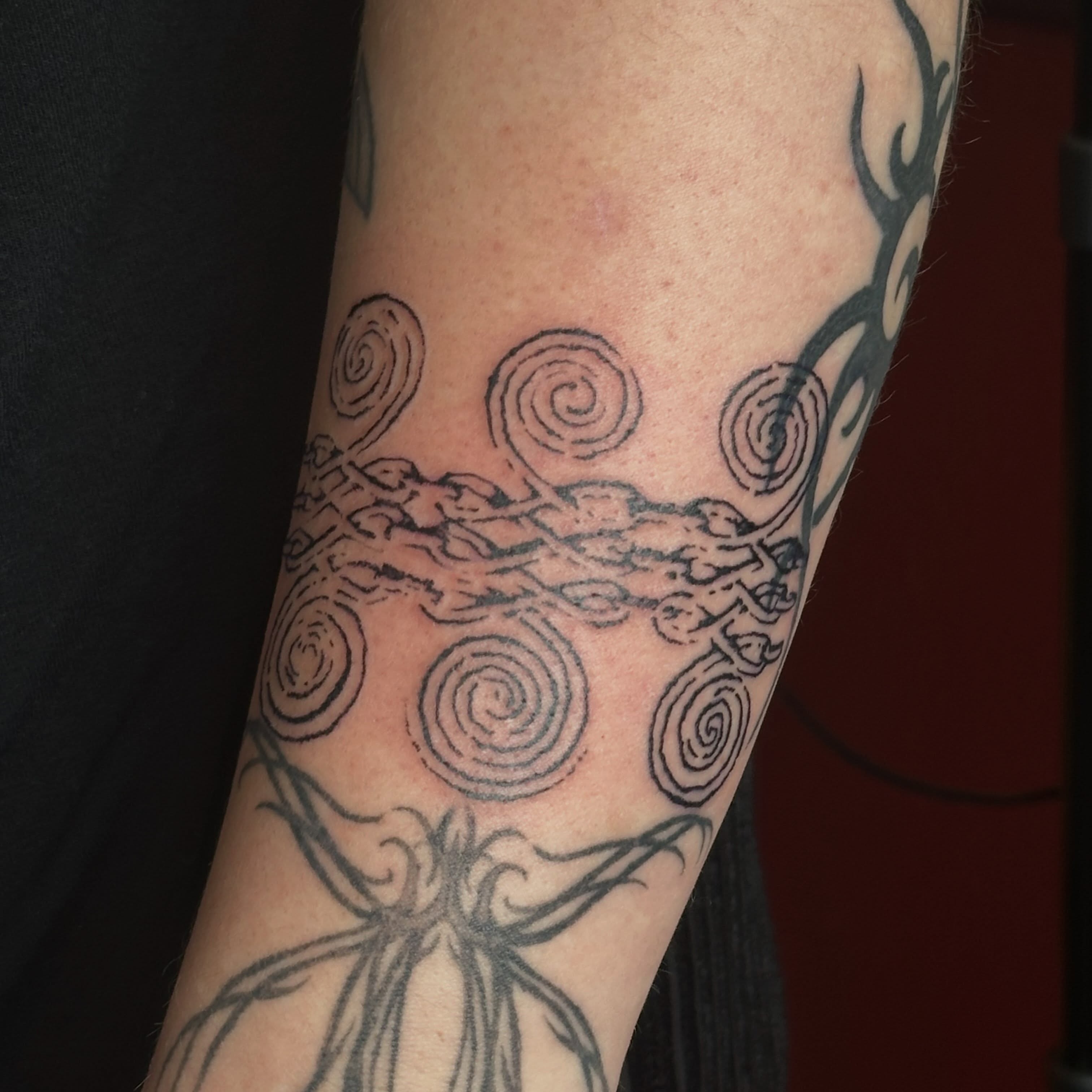 Spirals and abstract forms dotwork tattoo on the forearm by Jules🕯️