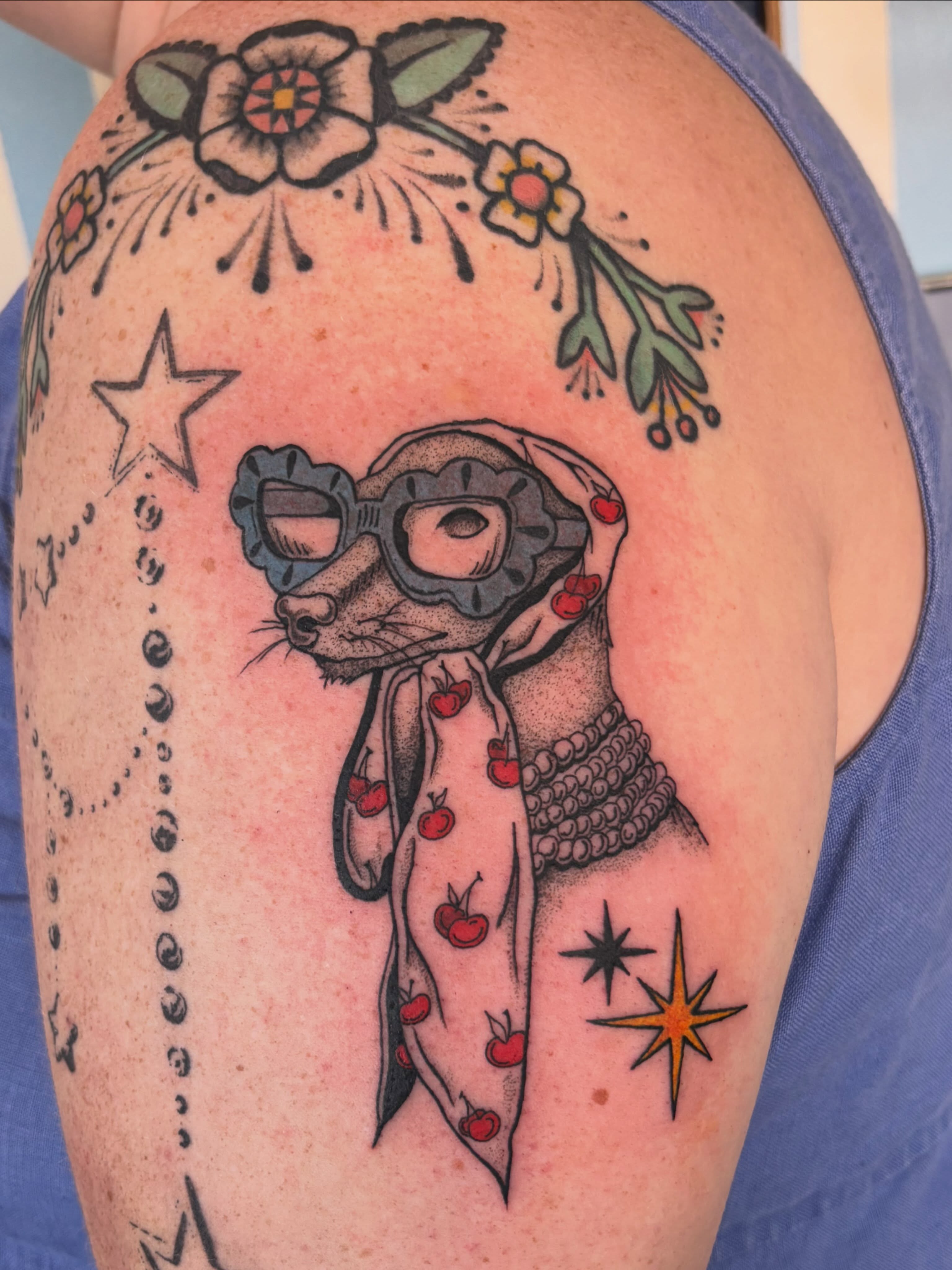Raccoon pilot American traditional tattoo on the shoulder by Ashley Ellerman