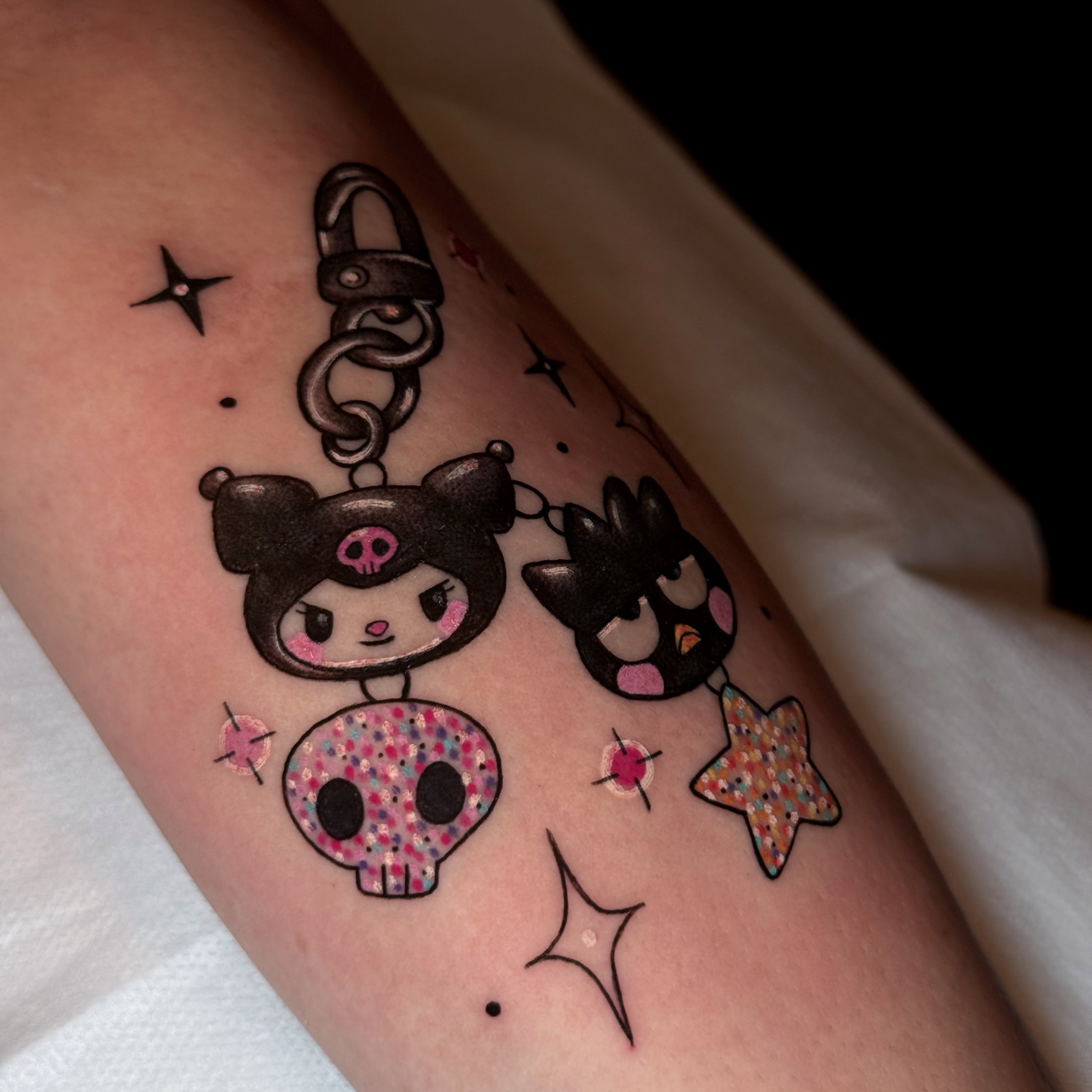 Kawaii characters dotwork tattoo on the forearm by Alexia