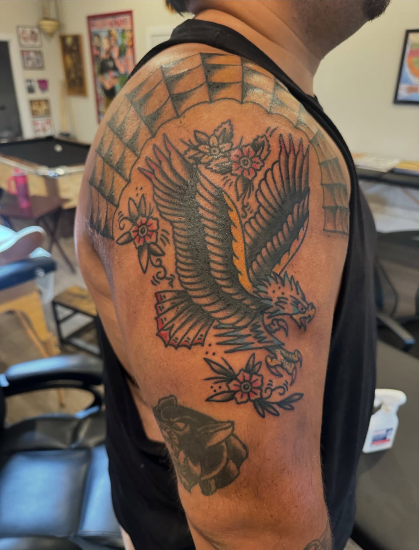 Eagle and flowers American traditional tattoo on the shoulder by Minneapolis