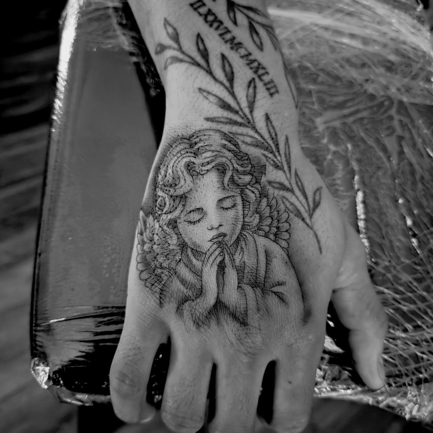 Praying angel realism tattoo on the hand by Luke Jordan Ink, Louisville, Colorado