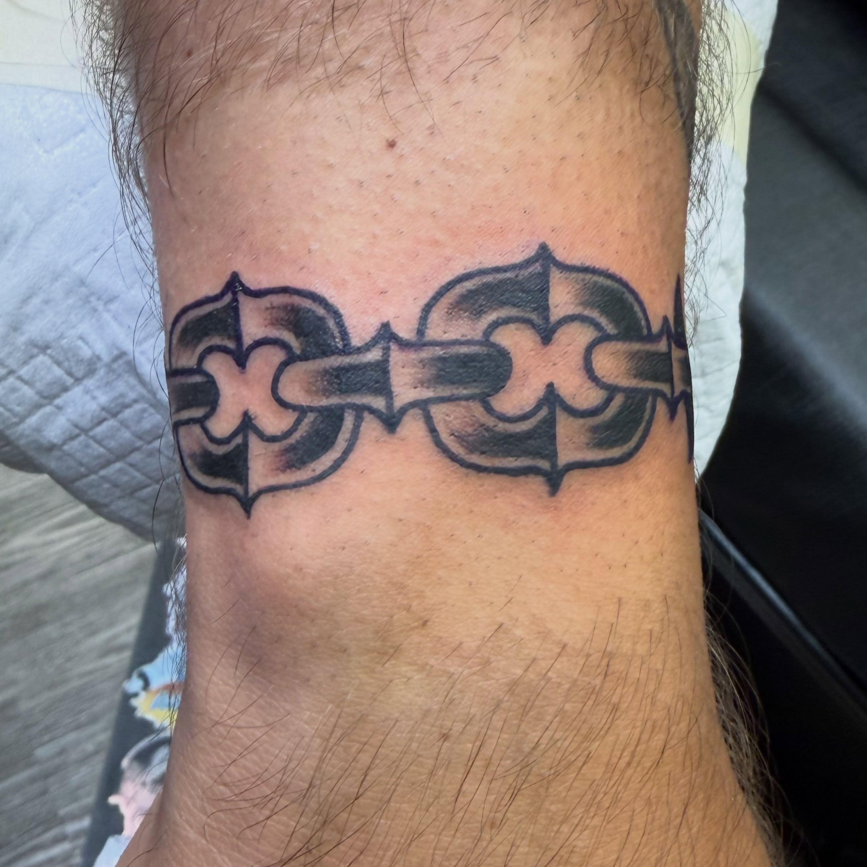 Crosses black and grey tattoo on the forearm by Amy Kolton