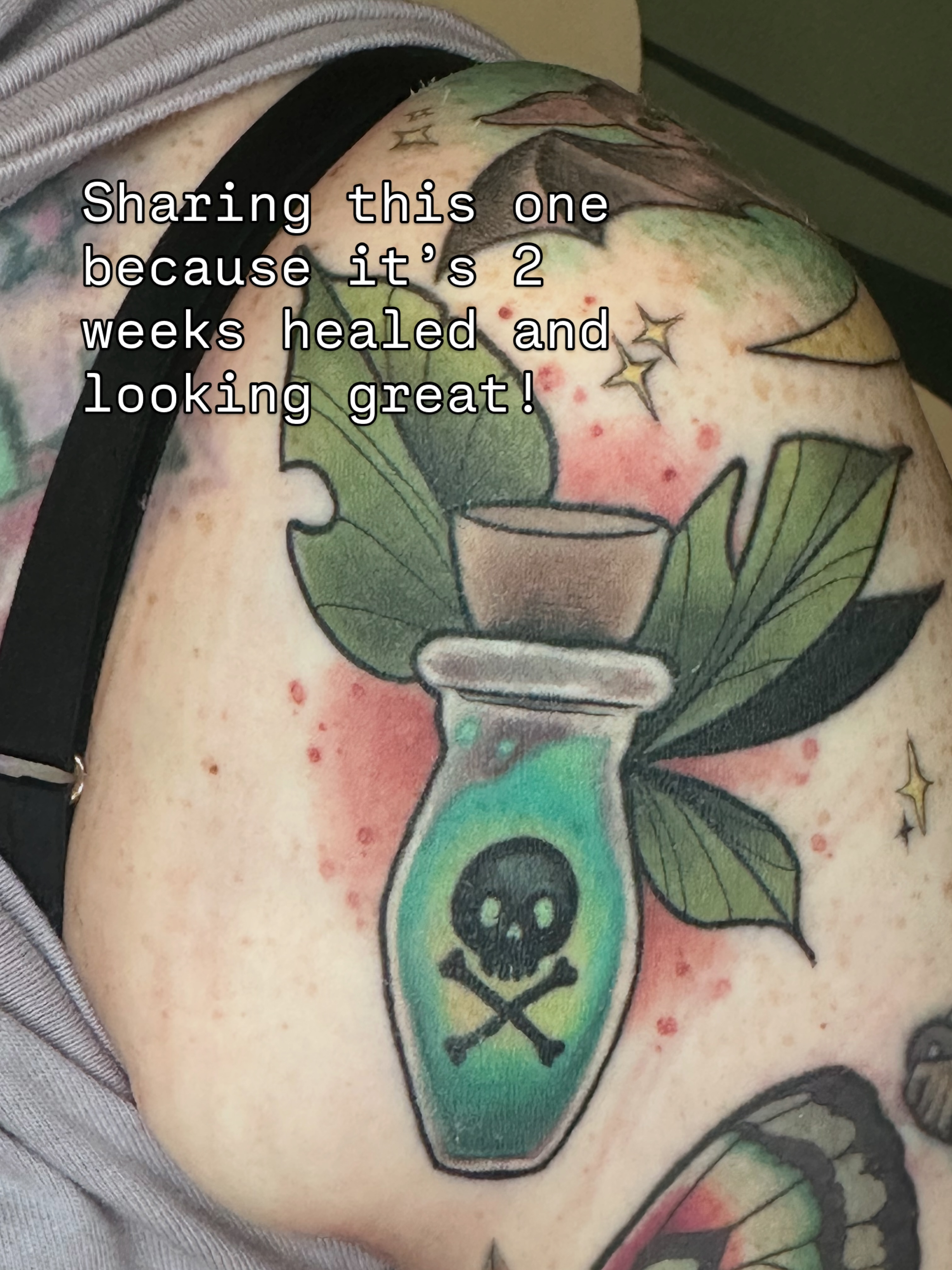 Poison bottle with skull and crossbones new school tattoo on the shoulder by Katie Hutchins, Dayton, Ohio