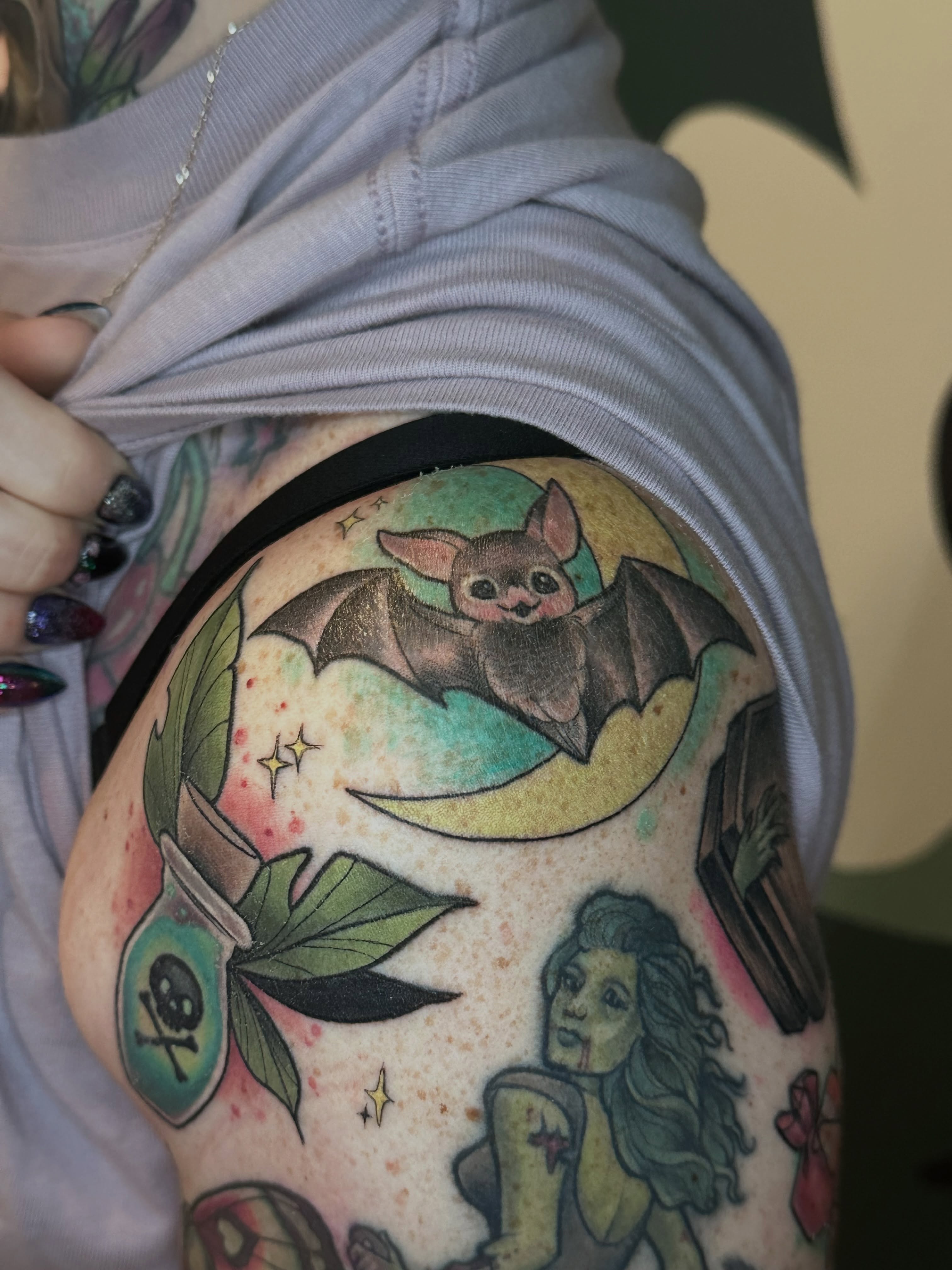 Bat and moon American traditional tattoo on the thigh by Katie Hutchins, Dayton, Ohio