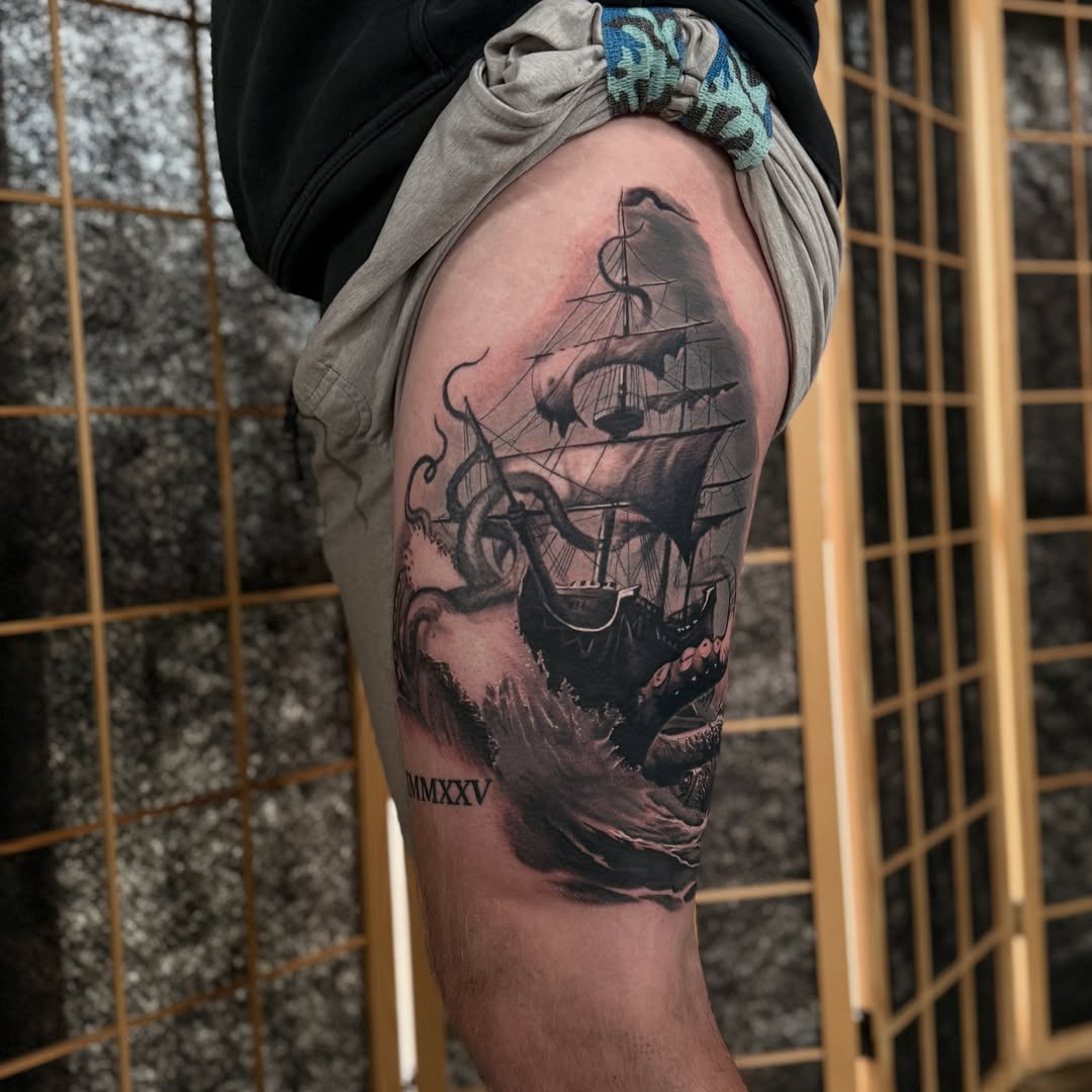 Ship and octopus realism tattoo on the thigh by Miles Haysmith