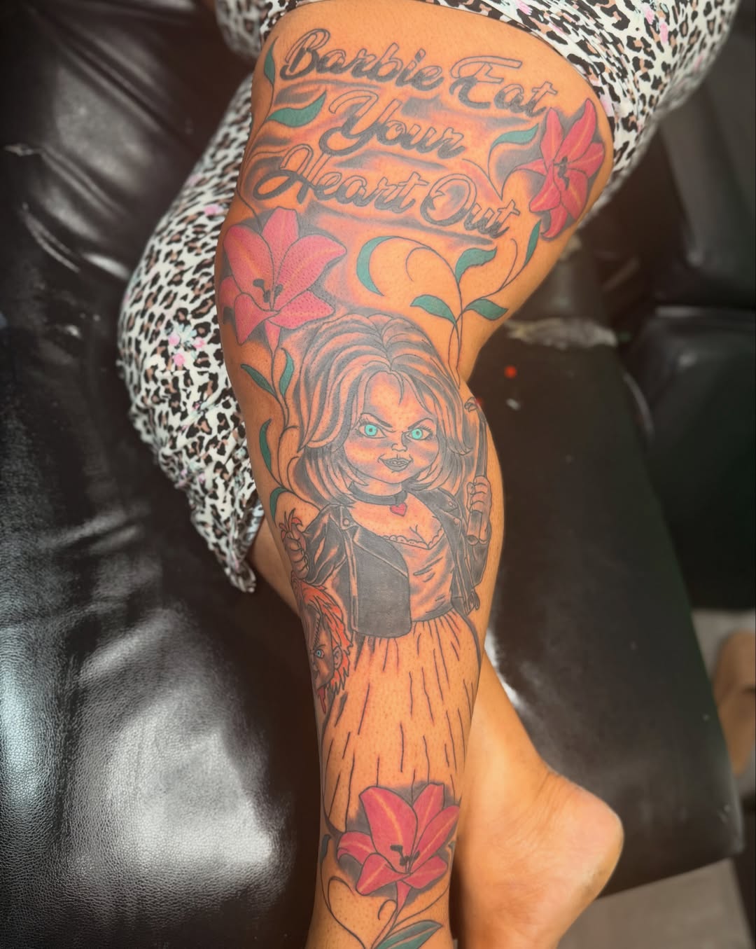 Chucky doll American traditional tattoo on the thigh by Bigtyga